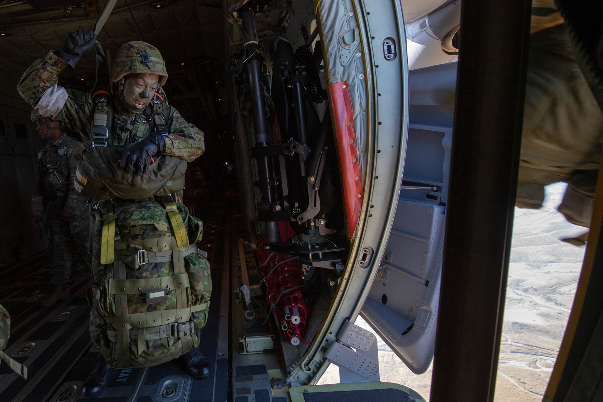 A Japan Ground Self-Defense Force soldier assigned to the 1st Airborne Brigade jumps from a U.S. Air Force C-130J Super Hercules assigned to the 36th Airlift Squadron over Hiju-dai drop zone, Oita prefecture, Japan, Nov. 4, 2018, during Keen Sword 19. Approximately 280 JGSDF personnel conducted jump training from U.S. Air Force C-130J Super Hercules’ for the first time in Japan. (U.S. Air Force photo by Yasuo Osakabe)
