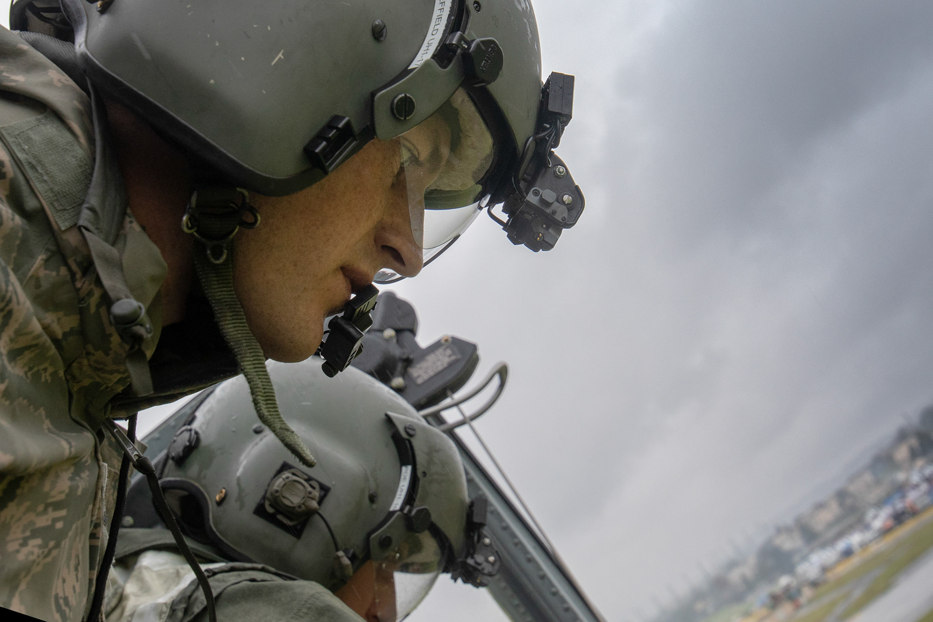 Tech. Sgt. Dustin Sheffield and Nicholas Poe, both with the 459th Airlift Squadron special mission aviators, perform visual confirmation during a Capabilities Exercise as part of the 2018 Japanese-American Friendship Festival at Yokota Air Base, Japan, Sept. 15, 2018. Members with the 459th AS showcased their rescue capabilities to execute search-and-rescue mission. (U.S. Air Force photo by Yasuo Osakabe)