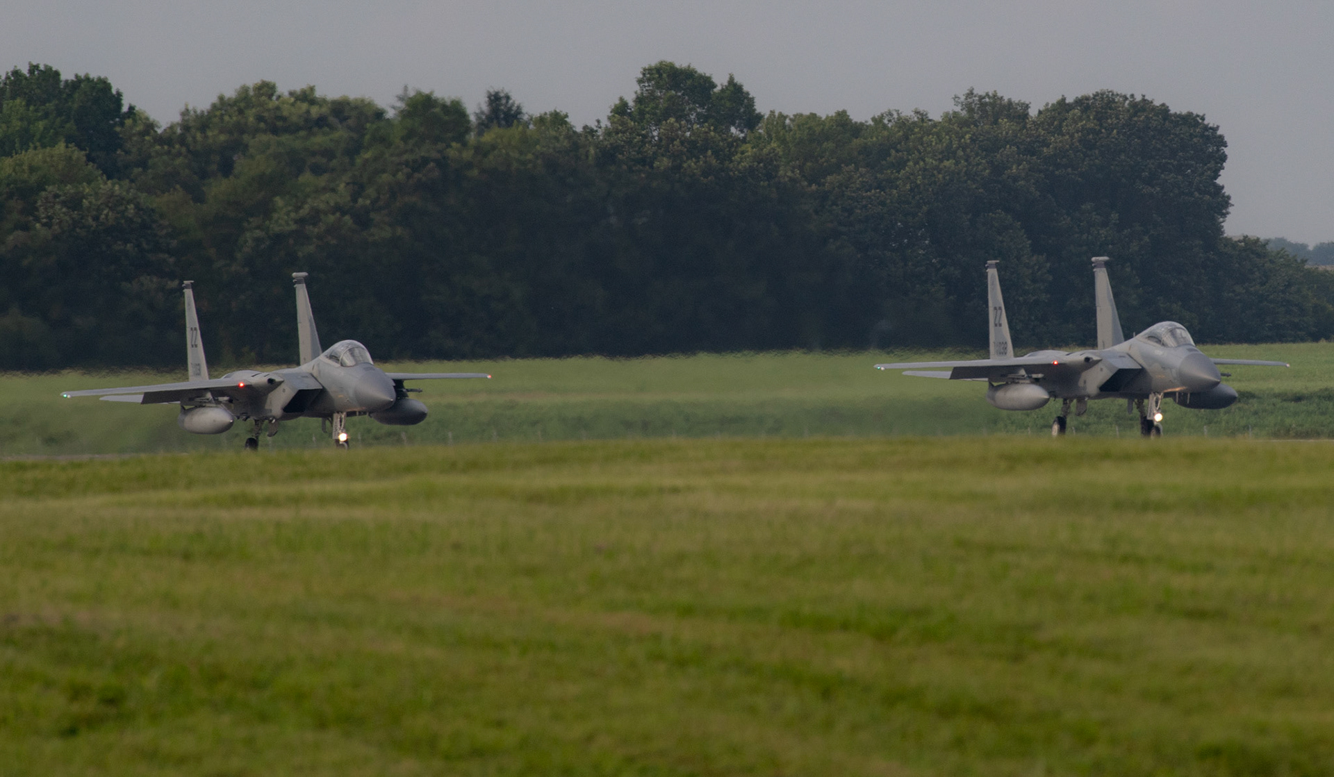 Two U.S. Air Force F-15 Eagles assigned to the 67th Fighter Squadron are ready to take off at Yokota Air Base, Japan, July 11, 2018, after declaring Tropical Cyclone Conditions of Readiness (TCCOR) All Clear at Kadena Air Base. Eighteen F-15 Eagle fighters evacuated to Yokota due to Typhoon Maria. The F-15 Eagle is a purpose-built air superiority fighter capable of detecting, acquiring and tracking enemy aircraft.(U.S. Air Force photo by Yasuo Osakabe)