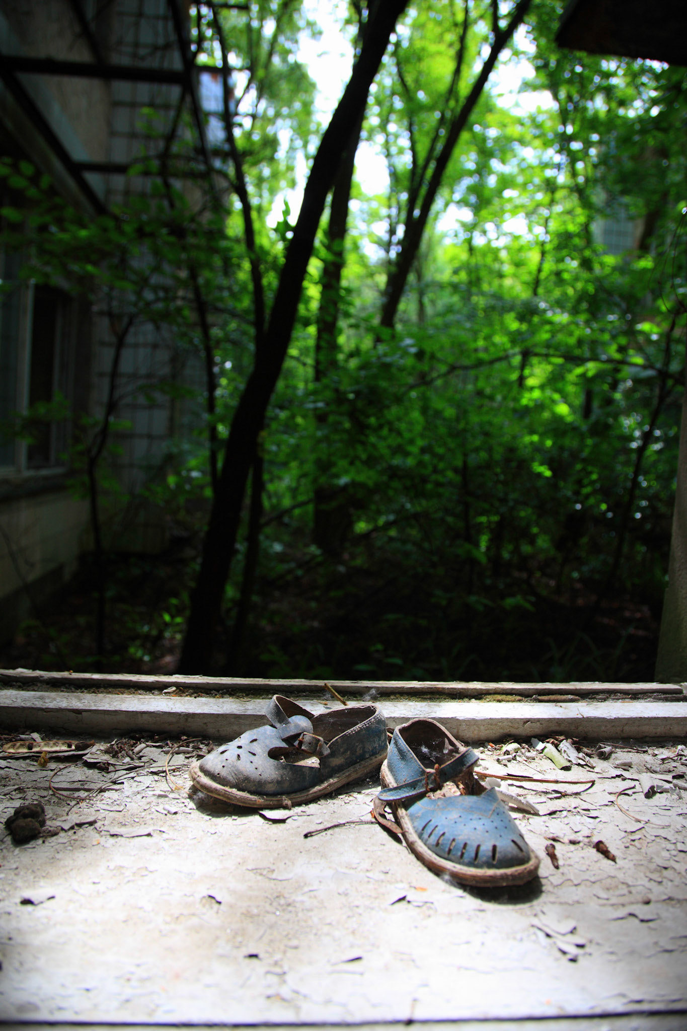 A pair of shoes are waiting for a kid at a kindergarten, Pripyat.