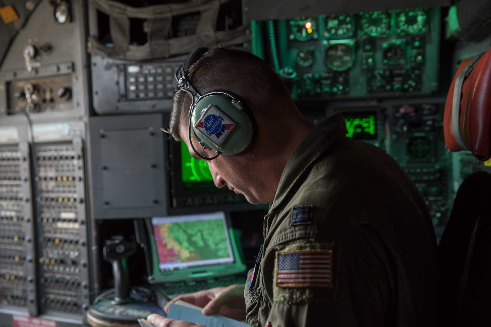 Capt. Andrew Kochman, 36th Airlift Squadron C-130H navigator, checks a route on a C-130H Hercules over the Kanto Plain, Japan, Oct. 5, 2017. This is the last active duty C-130H Hercules tactical training sortie. (U.S. Air Force photo by Yasuo Osakabe)