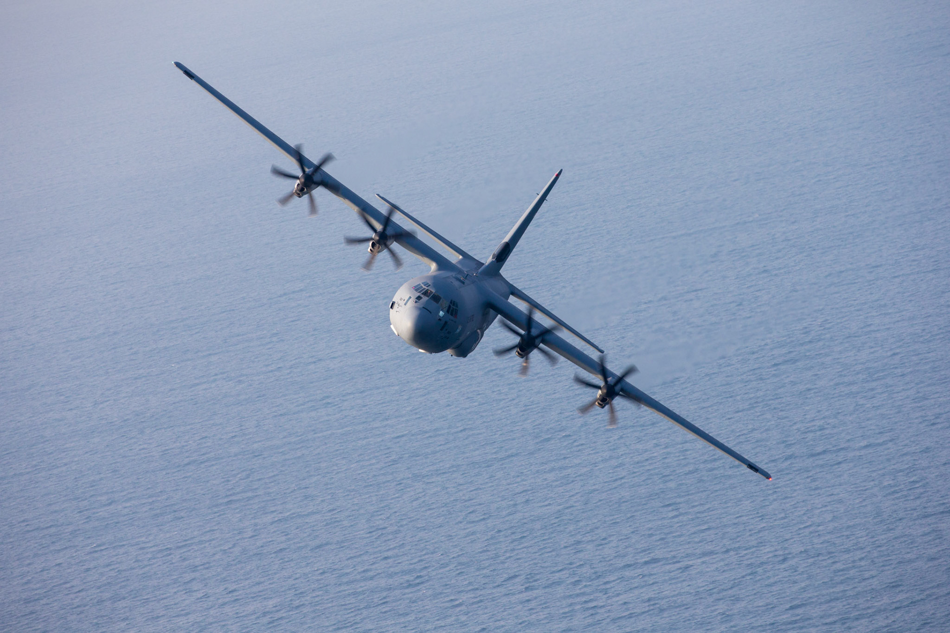 A U.S. Air Force C-130J Super Hercules assigned to the 36th Airlift Squadron flies near Suruga Bay, Japan, March 26, 2018. Performing regular in-flight operations gives all related personnel real-world experience to stay prepared for contingency situations and regular operations. (U.S. Air Force photo by Yasuo Osakabe)