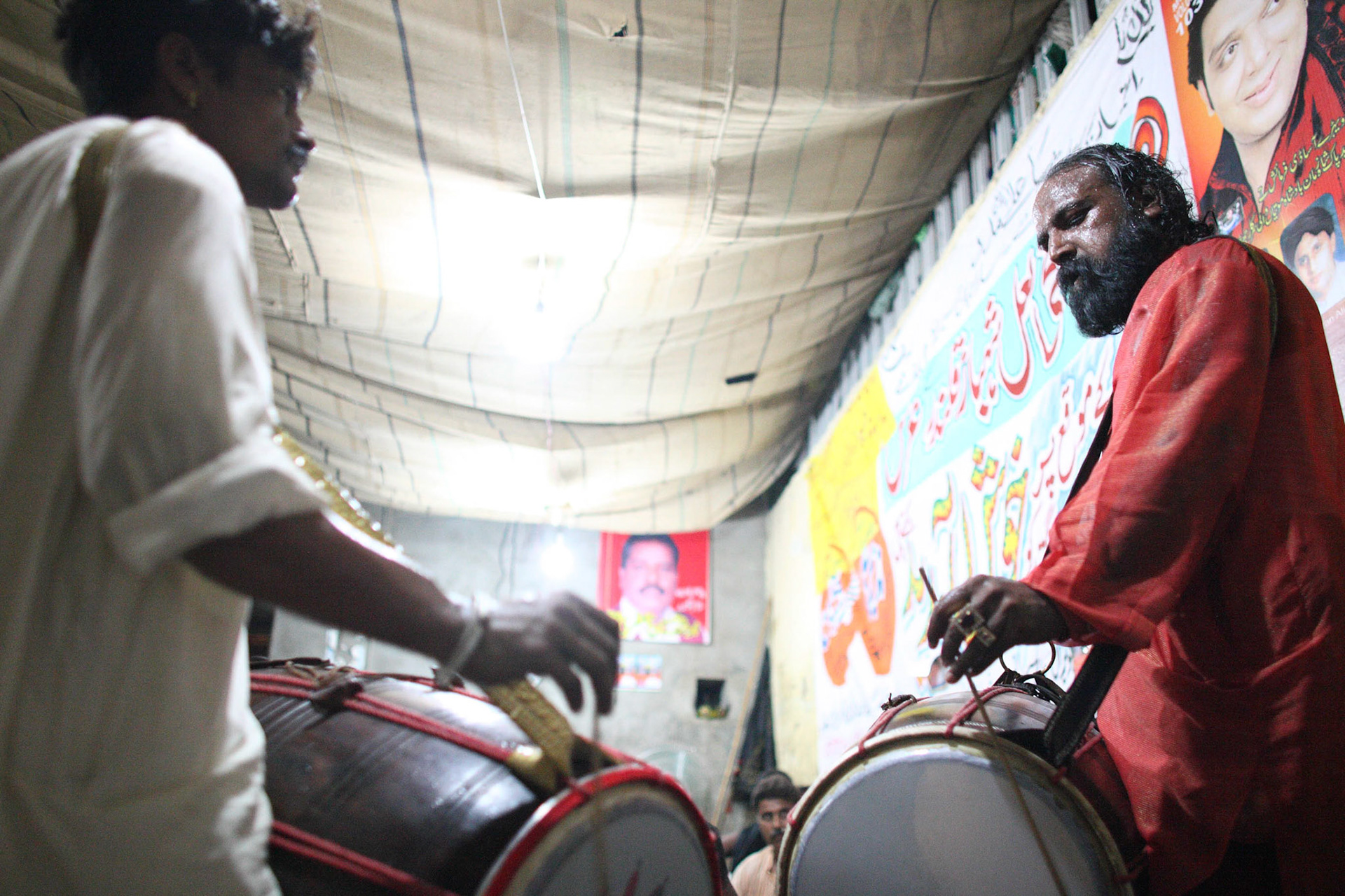 Pappu saeen (right) and Jhura saeen (left) are the most creative dhol players in Pakistan. They are from the tomb of Baba Shah Jamal, Lahore, Pakistan. When devotees listened their beat, It was led us in to Pappu and Jhura saeen's sufi world.Pappu and Jhura saeen had been played around the shrine of Hazrat Lal Shahbaz Qalandar during the festival. (Travel)