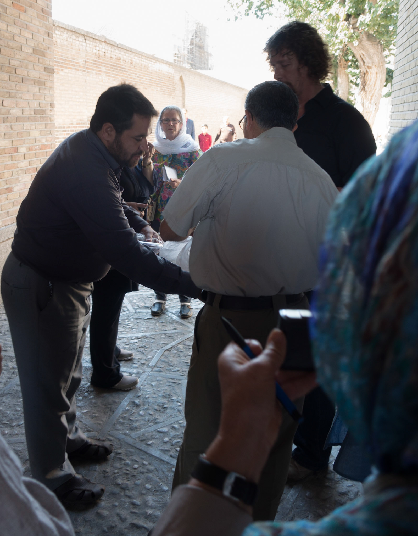 Qazvin:  Jami Mosque - Local man offering everyone a baklava and a welcome to Iran.