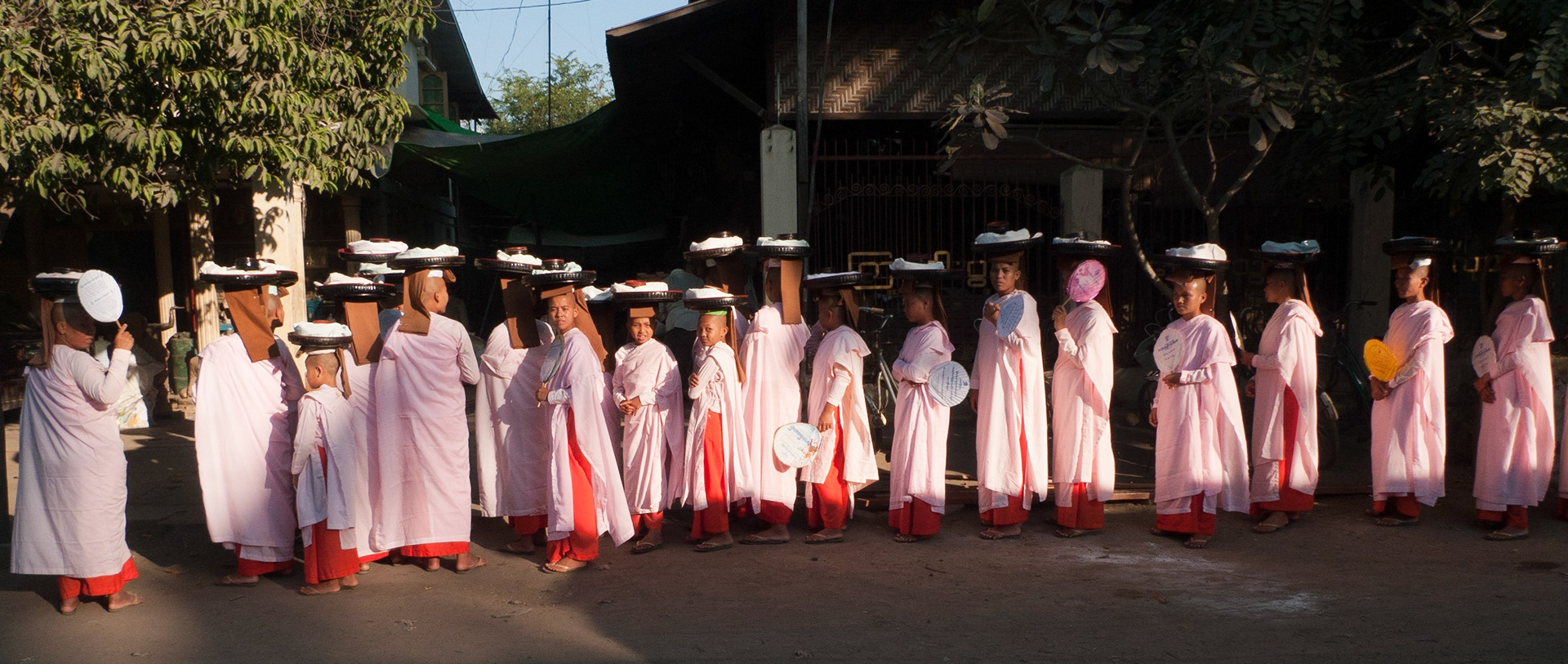 Mandalay: Nuns lining up for food.