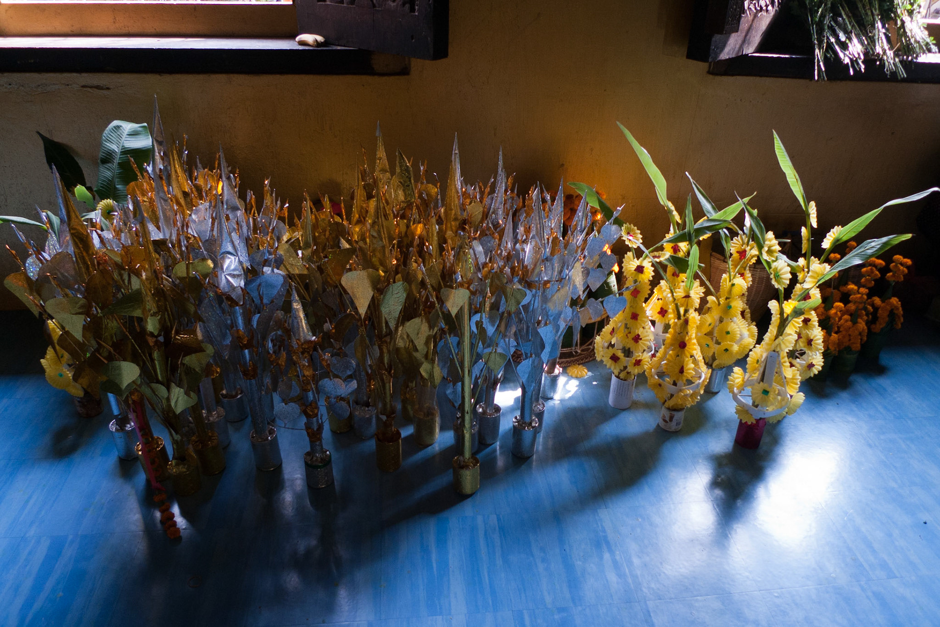 Vientiane: Wat Si Muang - pre-packaged offerings.