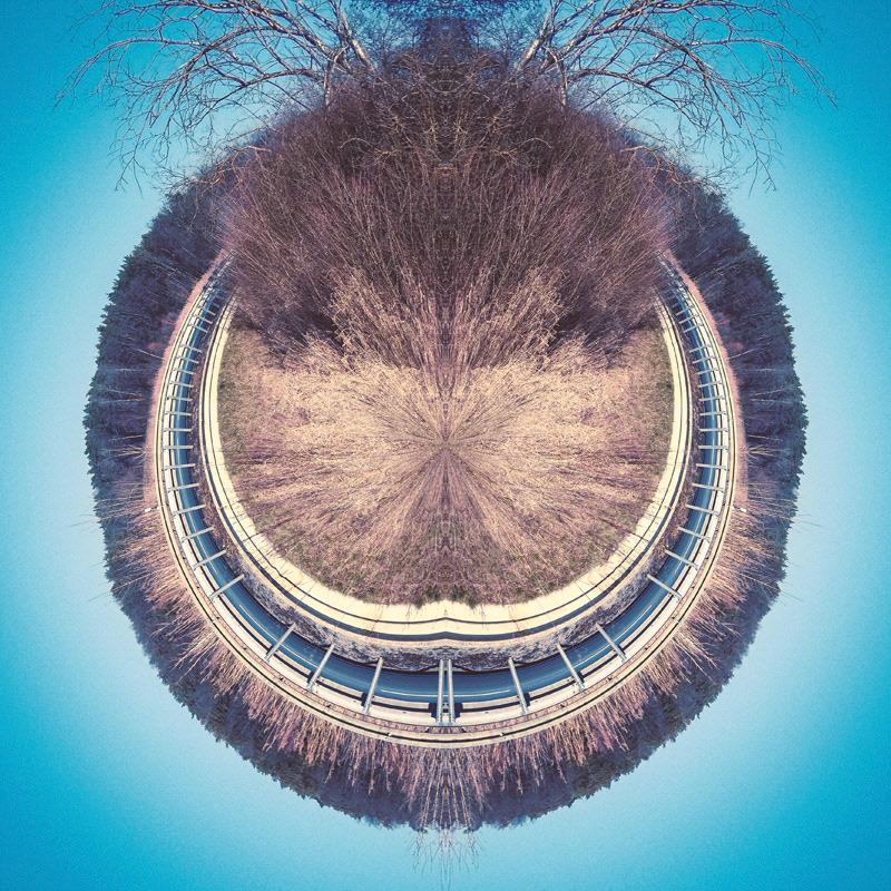 Introducing Herr Grinsemann ... in English you would call him "Mr. Grin". Everybody who knows my style is aware of that I love to play with symmetry and mirrored objects. In this case I've chosen a simple road in nature and made it round like this. The bushes and trees appearing as hairiness which fits perfectly into the face of Mr. Grin. Overall I have to say this is a funny one, but although I am still fascinating in creating stuff like this and seeing what is possible with simple (maybe sometimes boring) pictures.