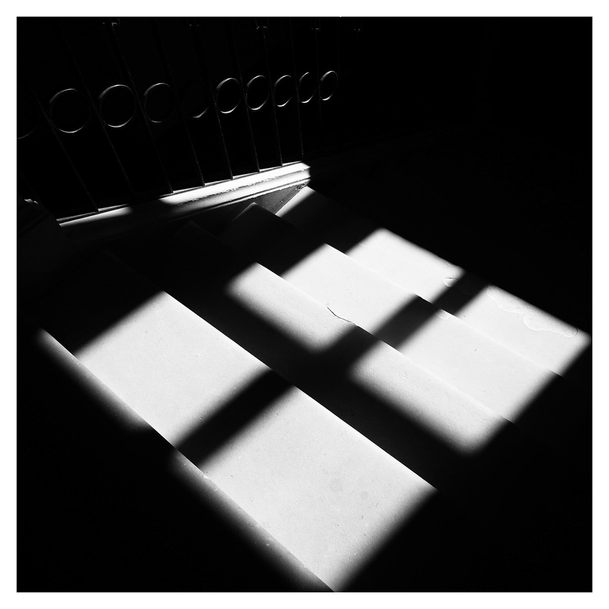 The light plays with the dark shadows in this old staircase of 1870.