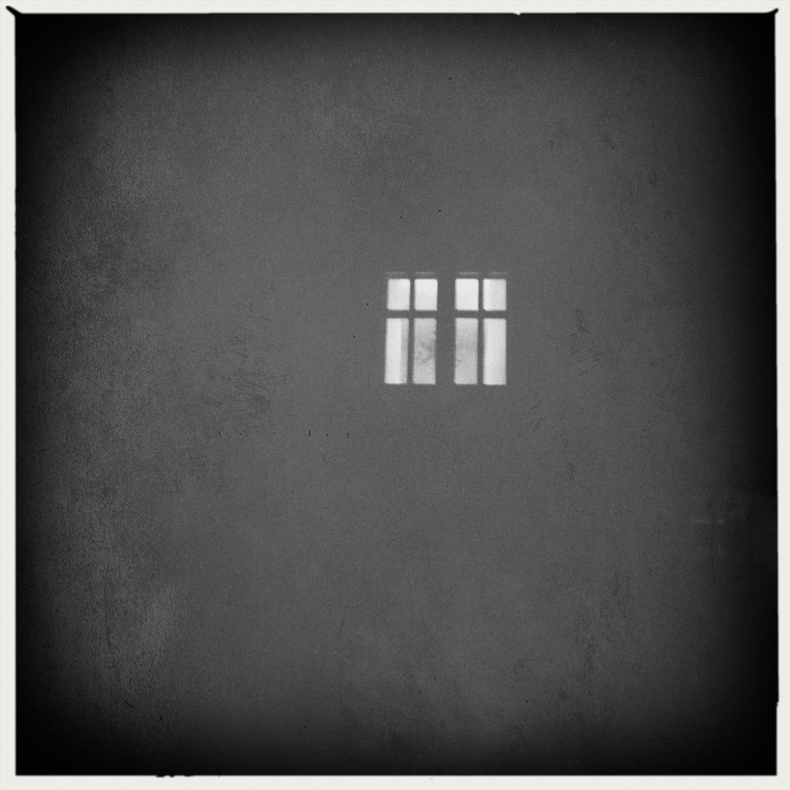 I love minimlism and simple pictures. I captured this picture at a night walk with my iPhone. It is very simple, clear, abstract but though interesting because it leads the viewer to the only important thing on the whole picture: To the lonely and bright window which is lightening the dark.