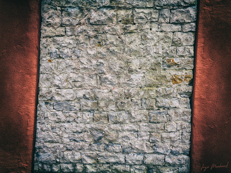 A really crooked brick wall between another two red walls. I like those abstract views.