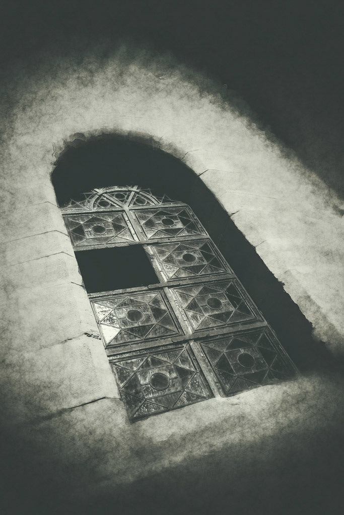 Abstract view to an old church window. The monochrome color makes this picture appearing really dramatically.