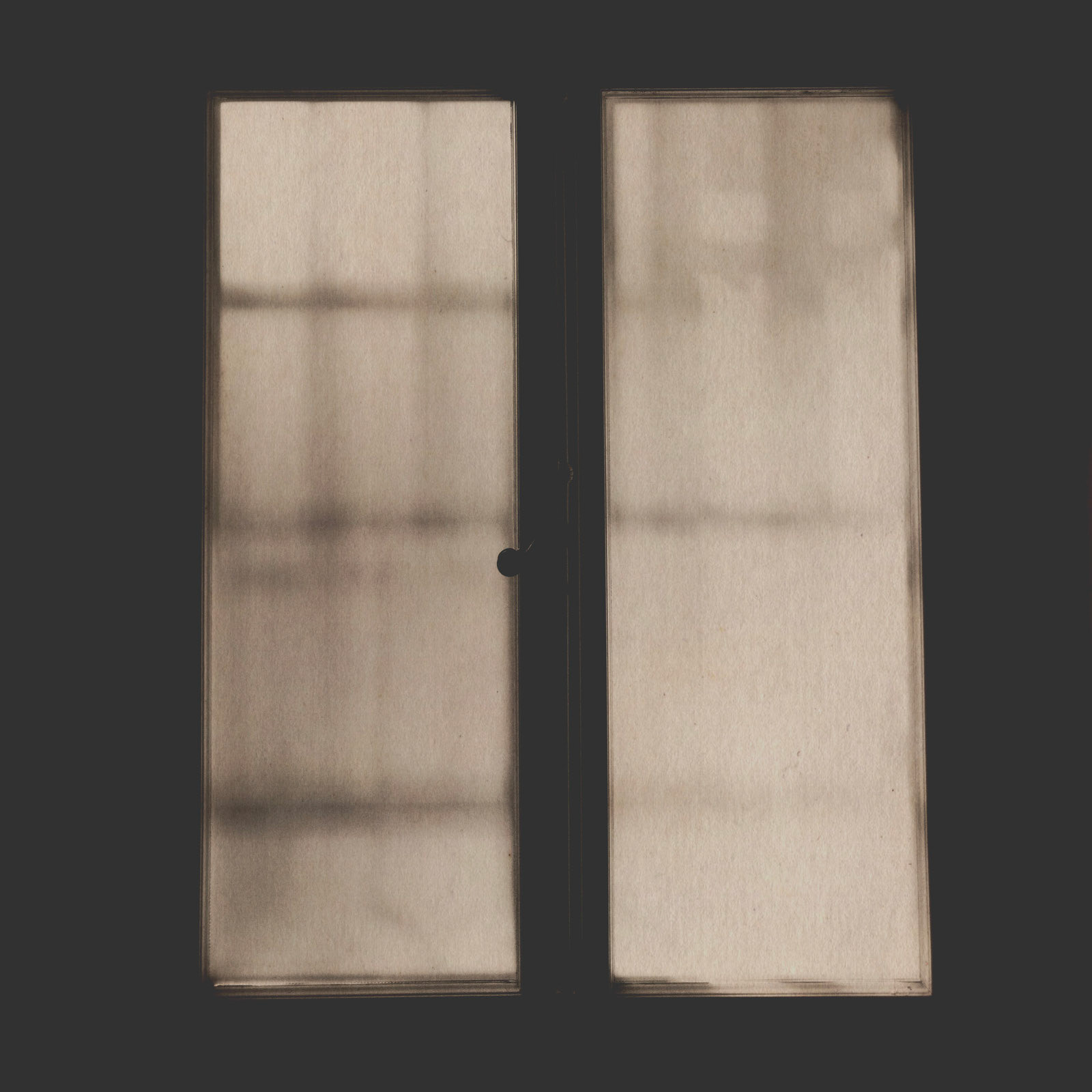 It feels creepy and uncomfortable to stand behind this window. Guess what's on the other side?