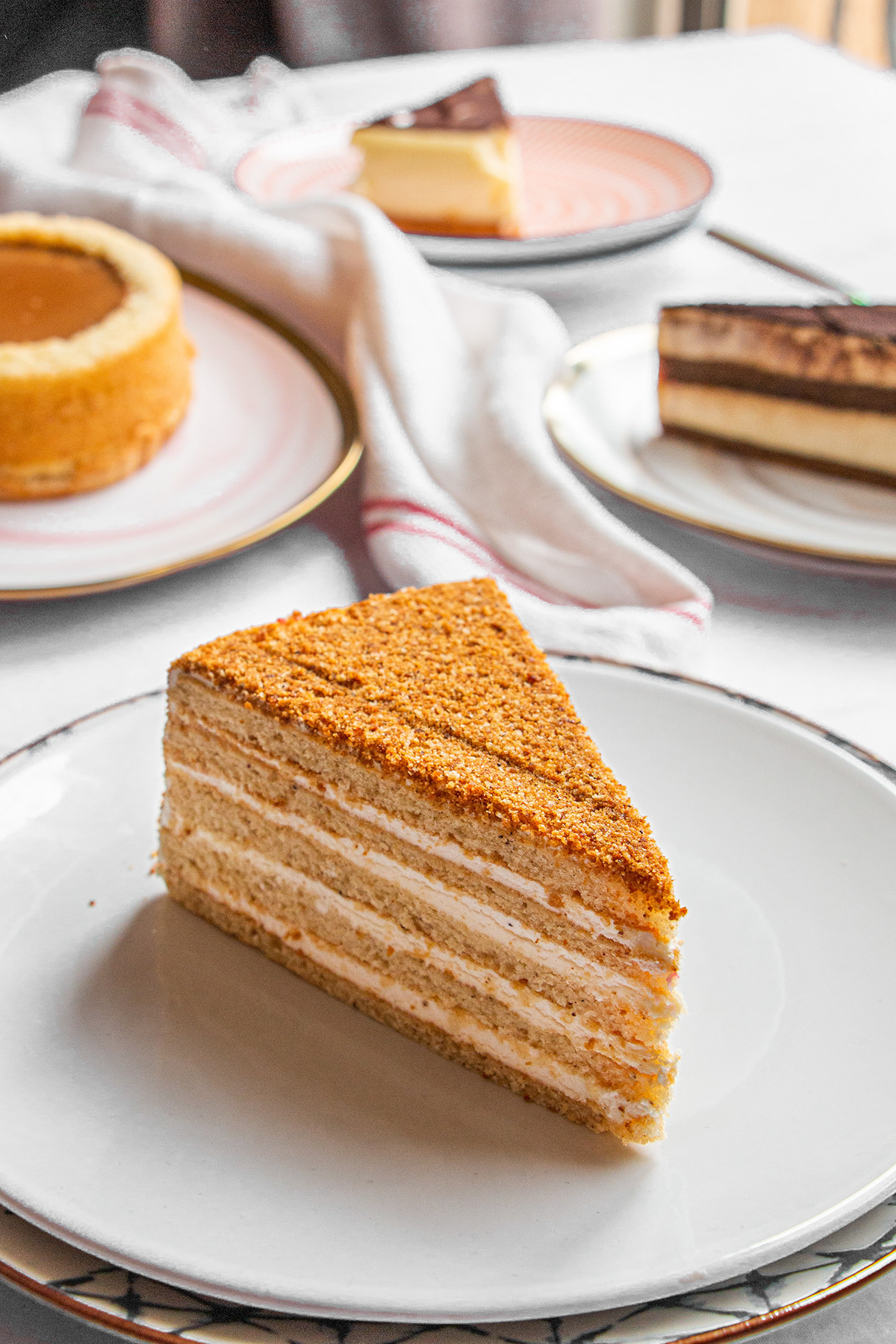 Slices of layered cake arranged on white plates