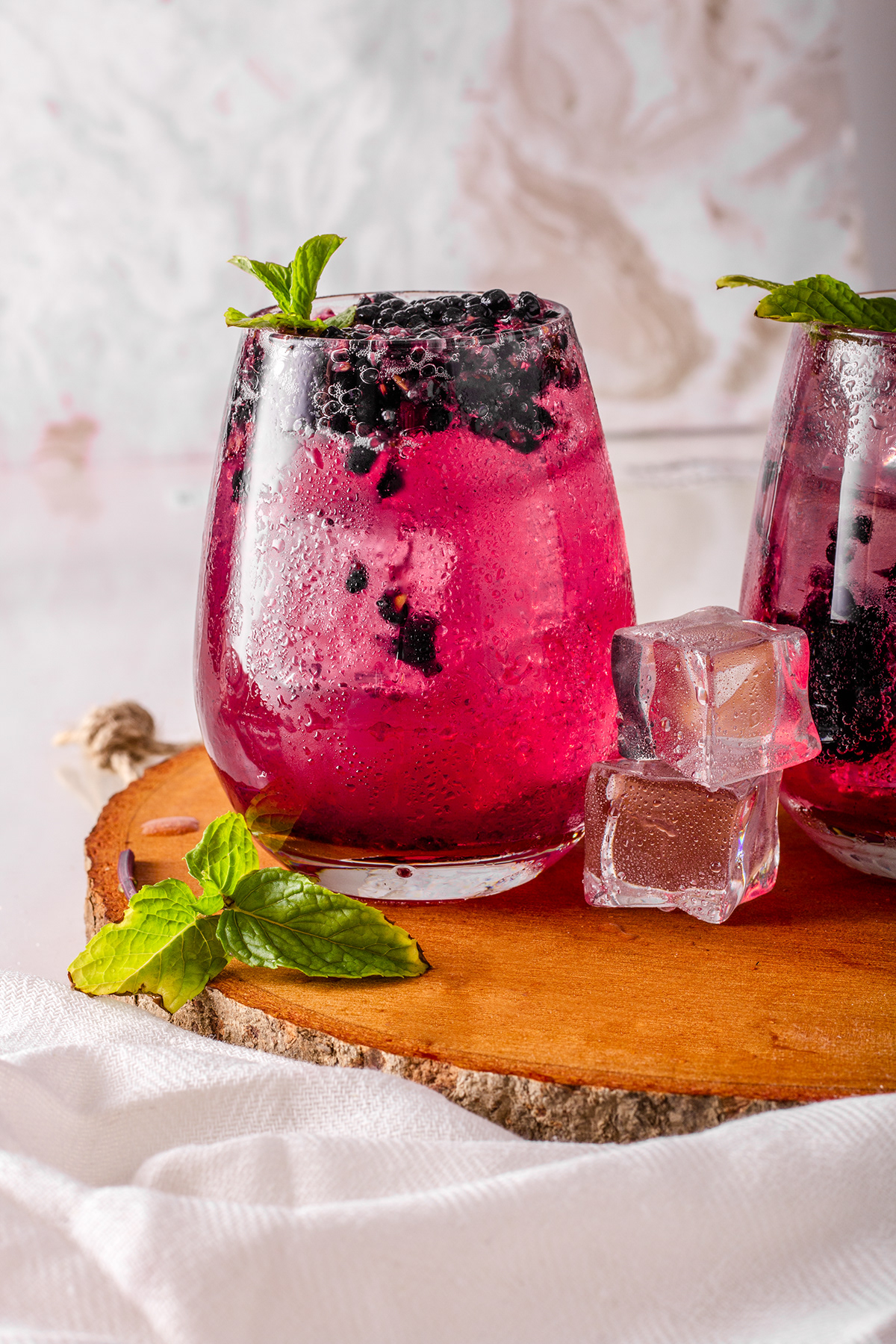Bright berry drinks with mint and ice