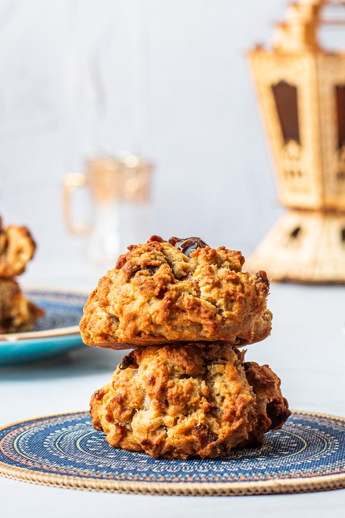 Two textured biscuits stacked on a patterned blue plate