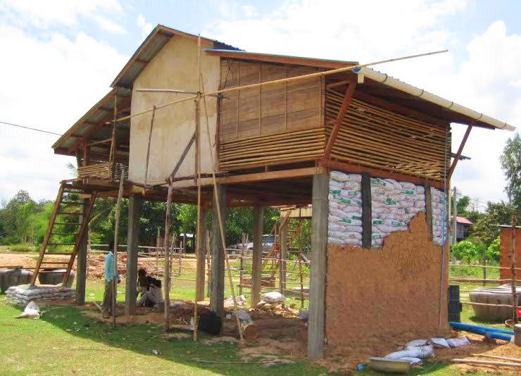 THE HOUSE DURING CONSTRUCTION – ONE OF THE WALLS IS USING THE EARTH BAGS TECHNIQUE