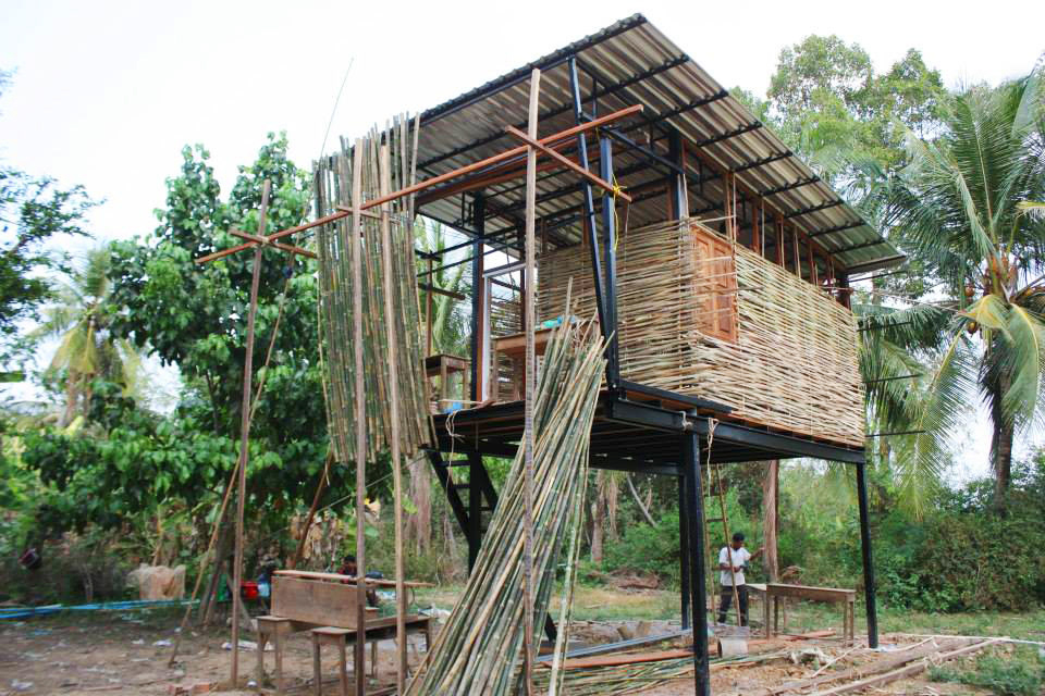 WOVEN BAMBOO AS WALLS SKELETON AND BAMBOO LOUVERS TO PROTECT THE FRONT BALCONY