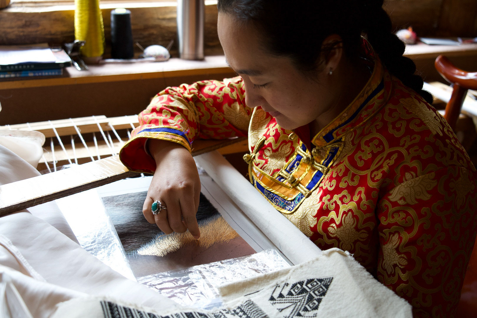 Nasha Minority Artisan painting with silk thread