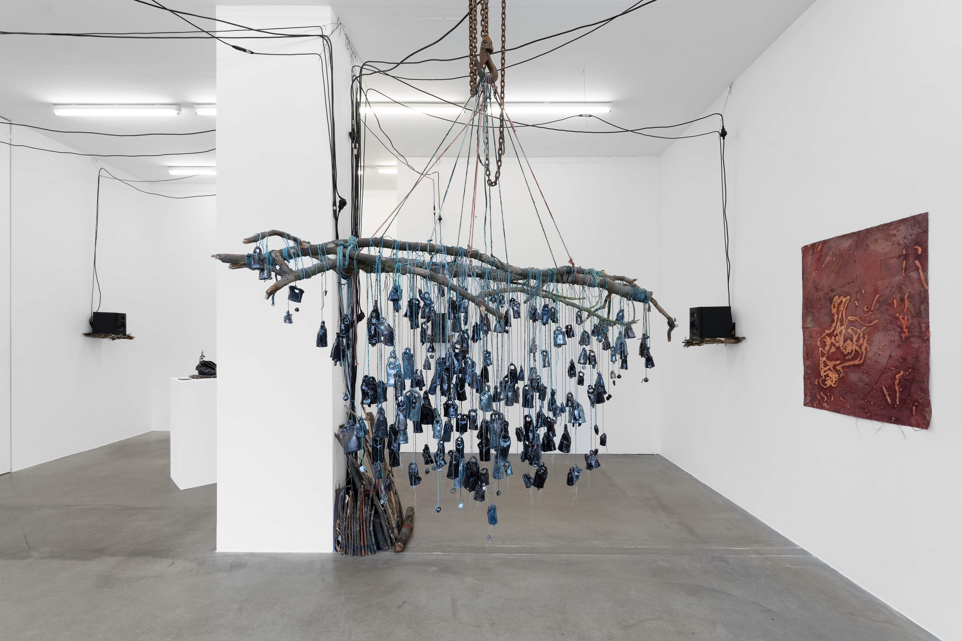 Umbratiles (the bells that did not ring), 2025, Cotton, glazed ceramics, pigment dye, wood, 185 x 28 x 84 cm