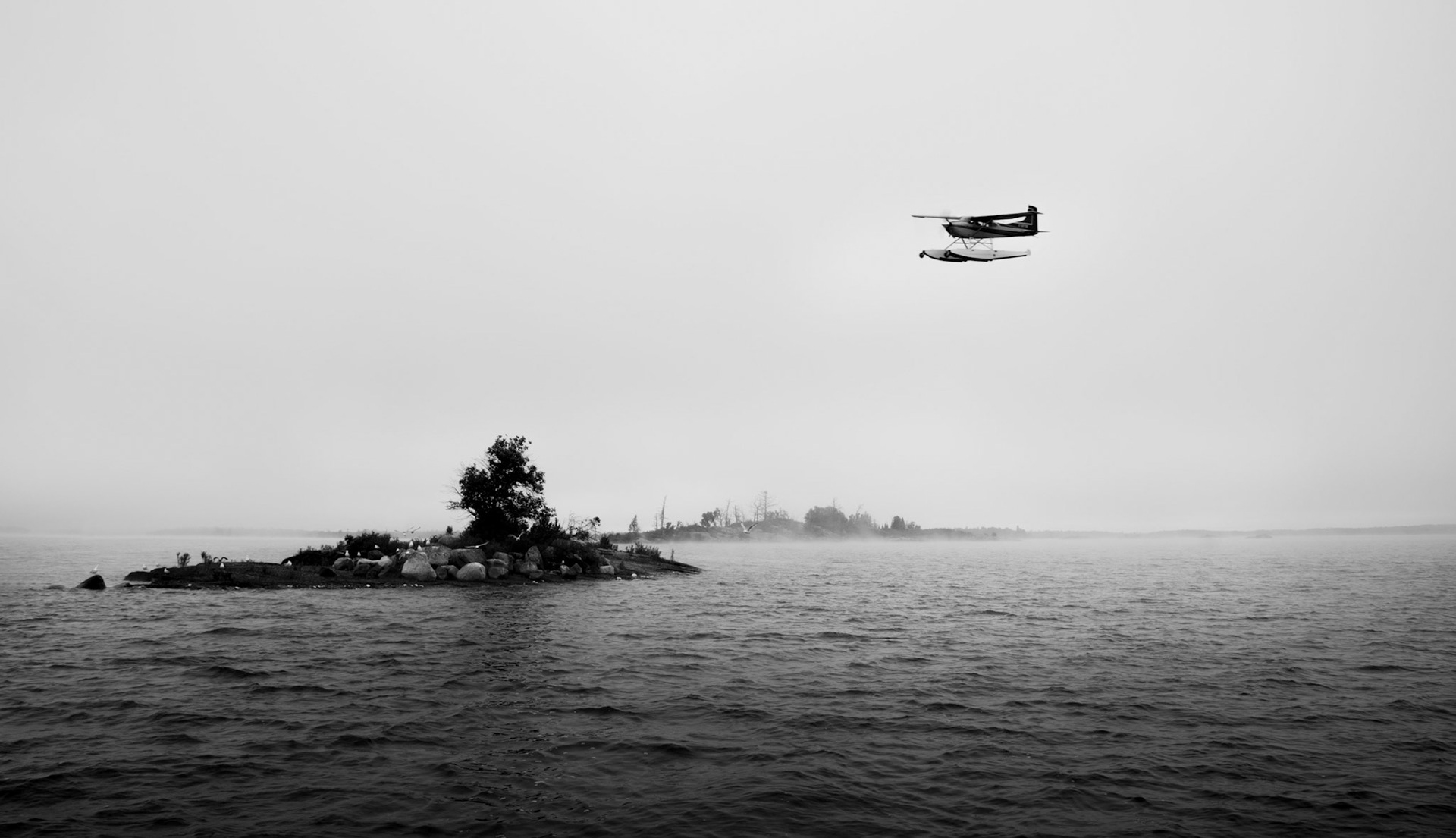 This photo was taken on the Lake of the Woods while fishing with my friend Harry one early morning in 2016.  There are something like 14500 islands dotting the lake - some are very large and some are just tiny piles of rock like the ones in this photo.  We were far away from civilization (or we thought so), when this plane buzzed just above us.  Was it looking for something or someone?  Was it delivering supplies to a remote cottage?  I will never know…