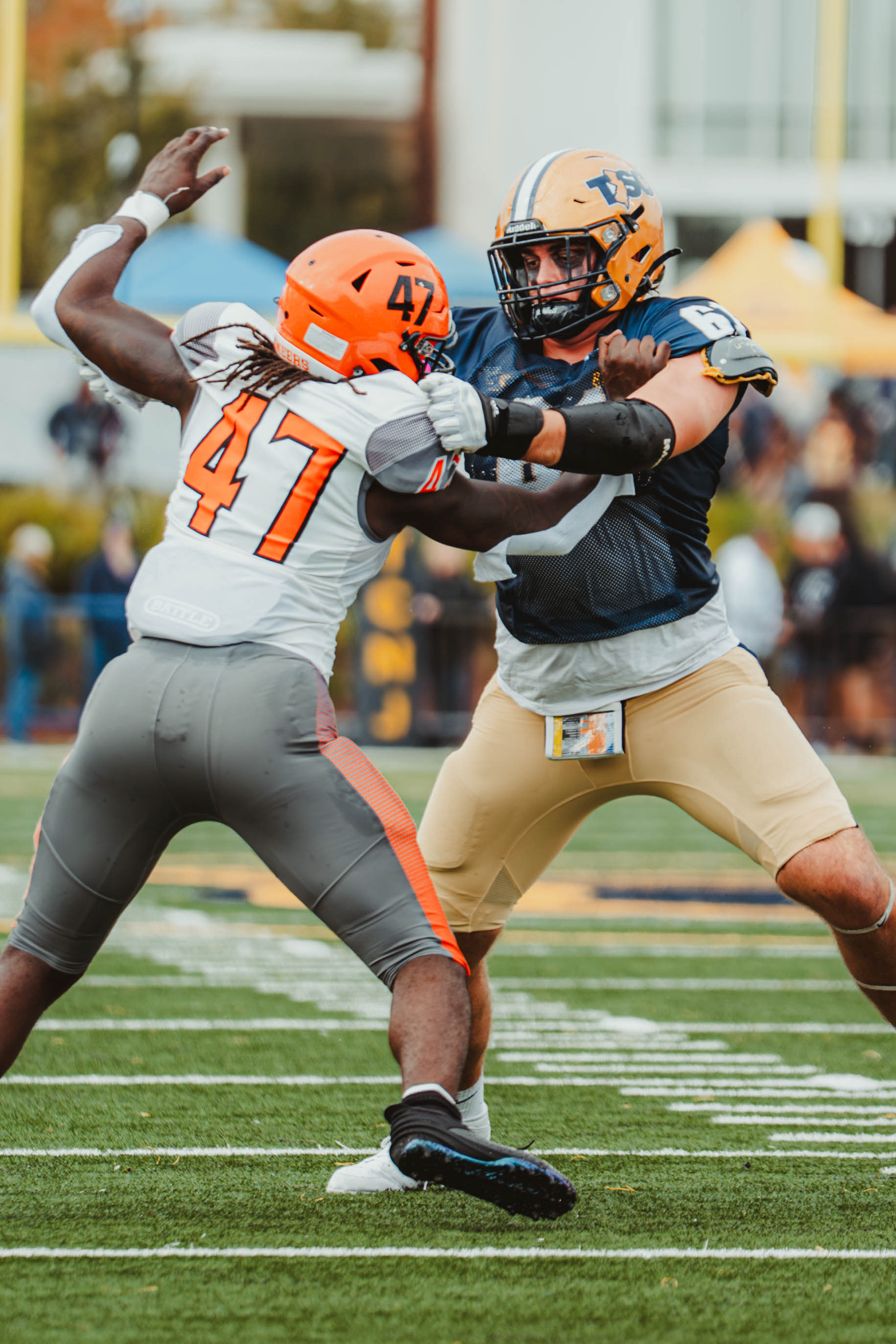 The College of New Jersey offensive lineman Teddy Shepardson (67) blocks William Paterson University linebacker Kevin Takizala (47) during a game at Lions Stadium in Ewing, N.J., on Oct. 11, 2025.