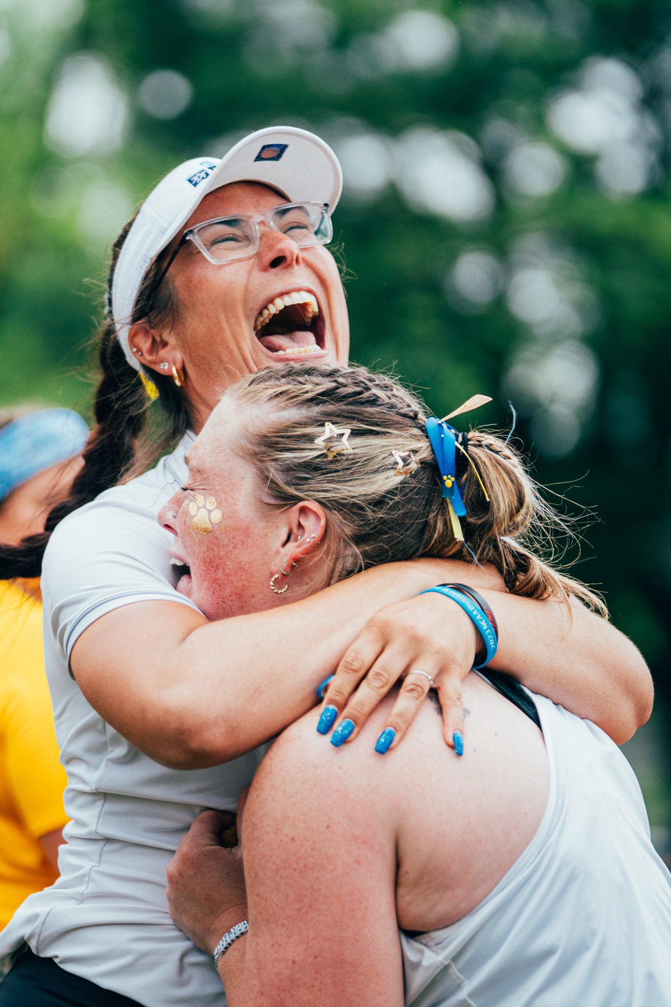 The College of New Jersey throwing coach Liz Madden celebrates with thrower Kerri McCarthy during the NJAC Championship at the TCNJ Track Complex in Ewing, N.J., on May 4, 2025.