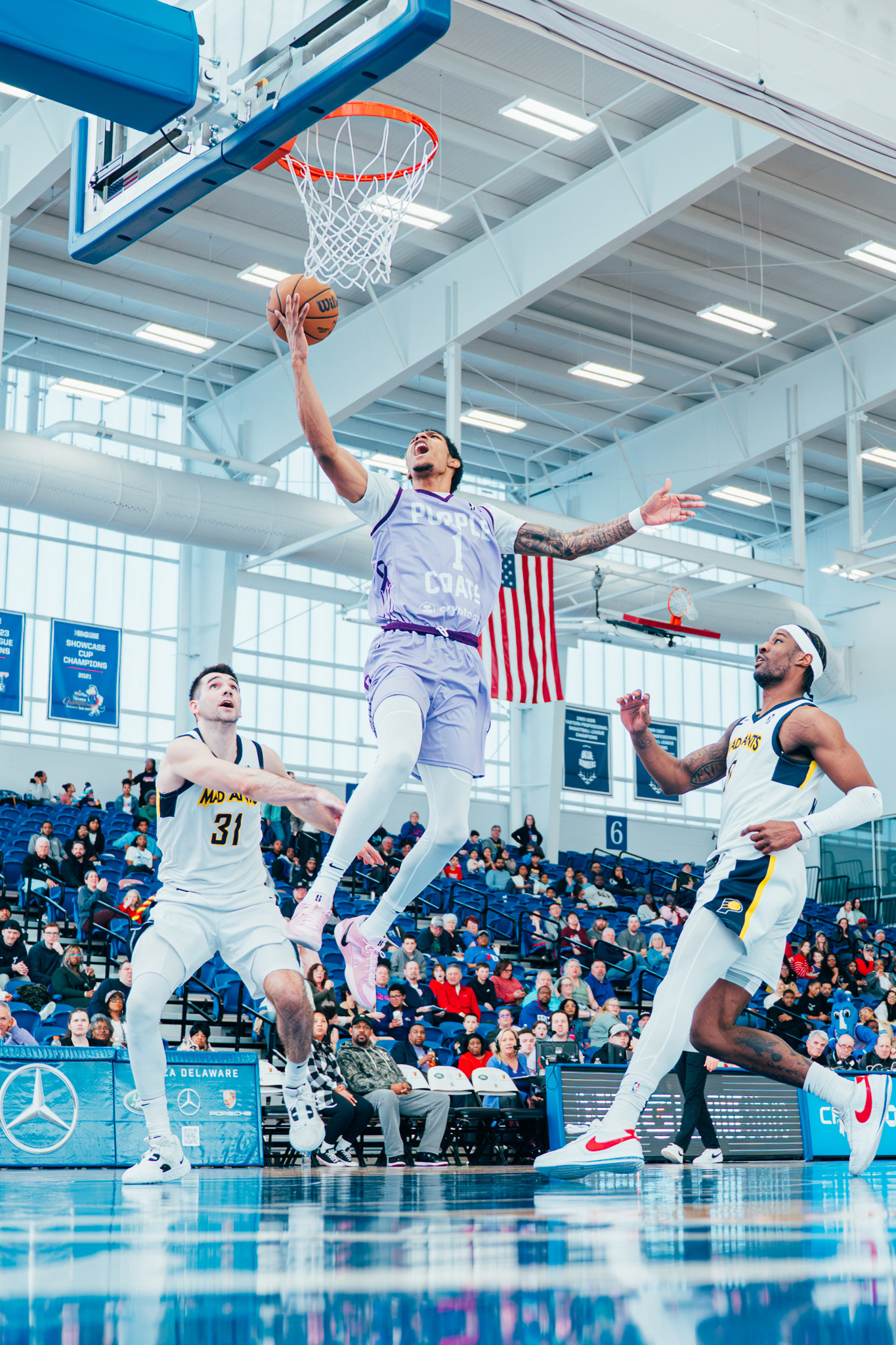 Delaware Blue Coats guard Patrick McCaw (1) drives to the basket against Indiana Mad Ants at Chase Fieldhouse  in Wilmington, DE., on Mar. 9, 2025.
