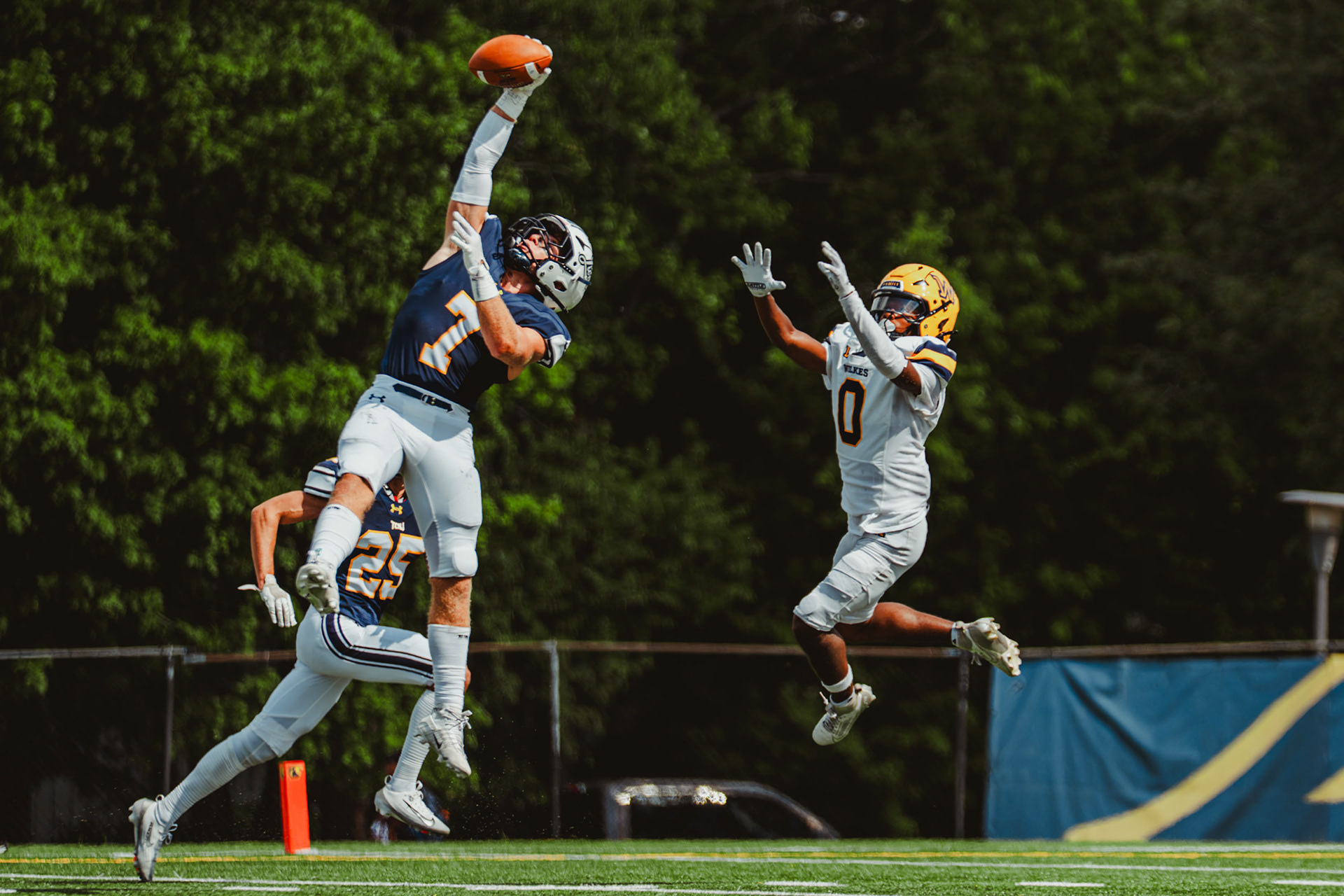 The College of New Jersey defensive back Justin Kurc (7) makes an interception against Wilkes University at Lions Stadium in Ewing, N.J., on Sep. 13, 2025.