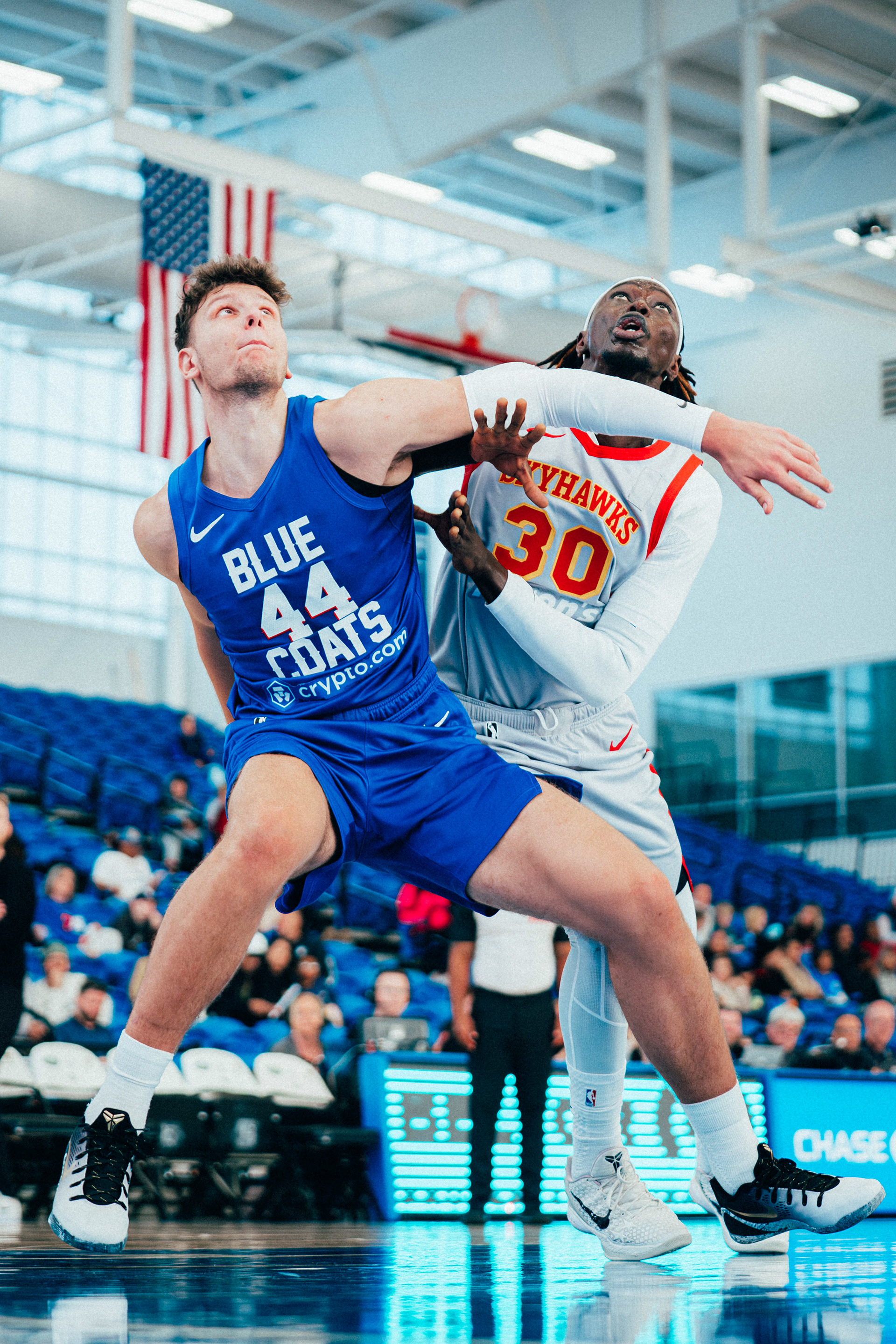 Delaware Blue Coats forward Igor Miličić Jr. (44) boxes out College Park Skyhawks forward Eli N'Diaye (30) during a free throw at Chase Fieldhouse on Nov. 29, 2025.