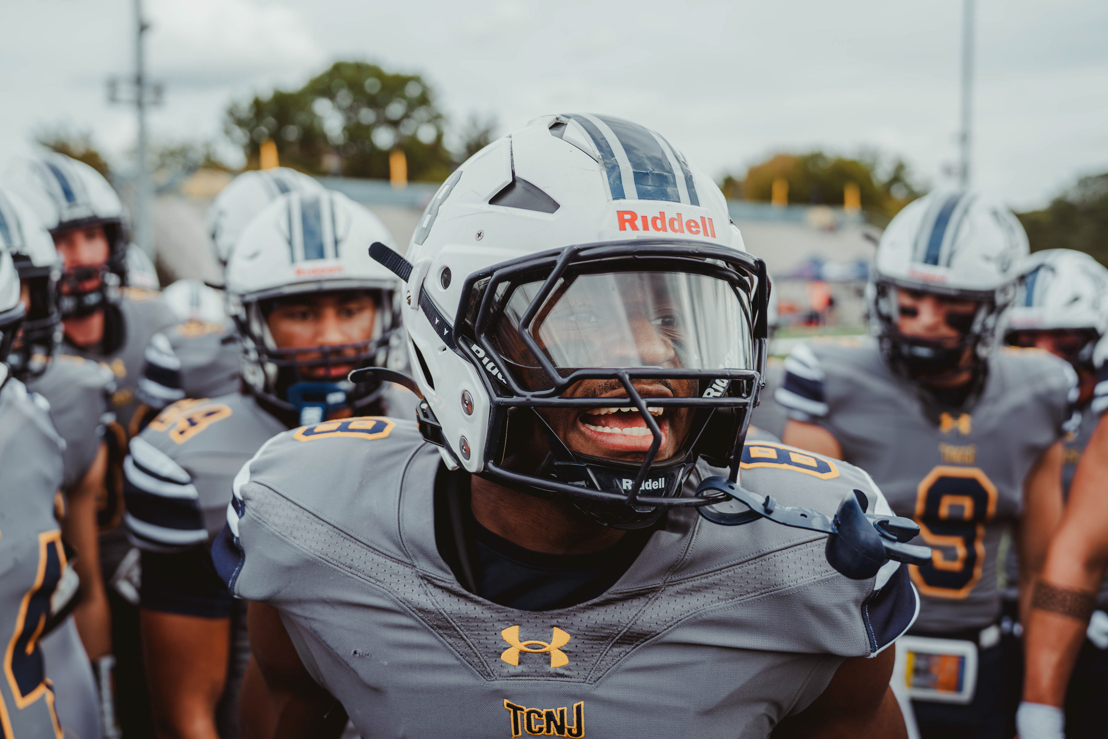 The College of New Jersey defensive back Christian Bennett (8) fires up teammates during pregame warmups before a game against Kean University at Lions Stadium in Ewing, N.J., on Oct. 25, 2025.