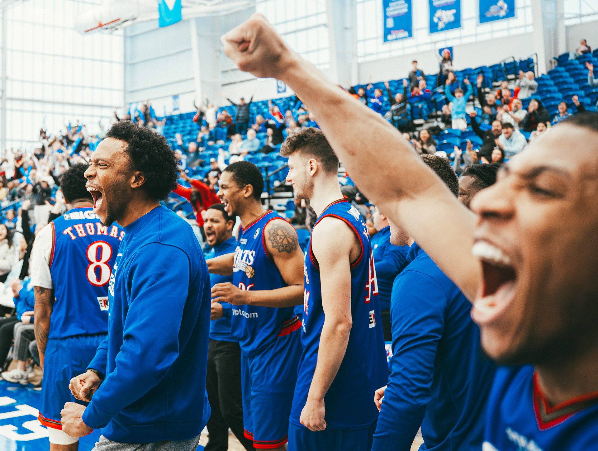 Delaware Blue Coats players celebrate a 119–118 win over the Iowa Wolves at Chase Fieldhouse  in Wilmington, DE., on Dec. 31, 2024.