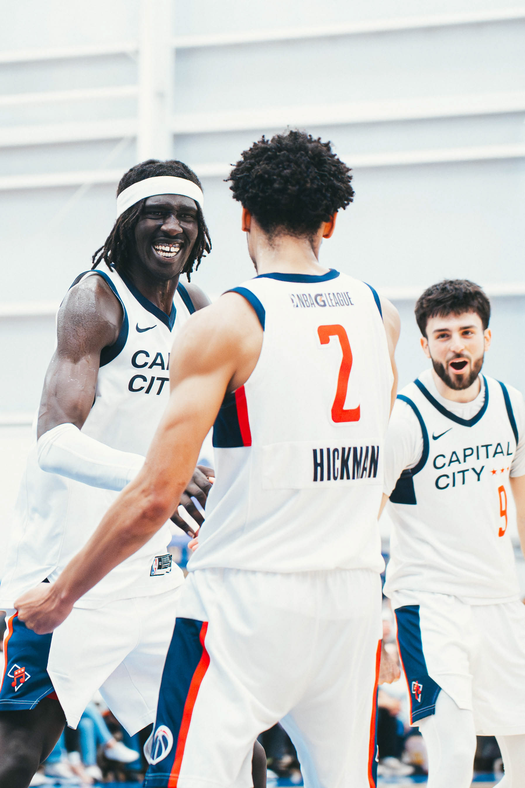 Capital City Go-Go forward Akoldah Gak (47), guard Nolan Hickman (2), and guard Chris Mantis (9) celebrate after forcing overtime against the Delaware Blue Coats at Chase Fieldhouse in Wilmington, DE., on Mar. 29, 2026.