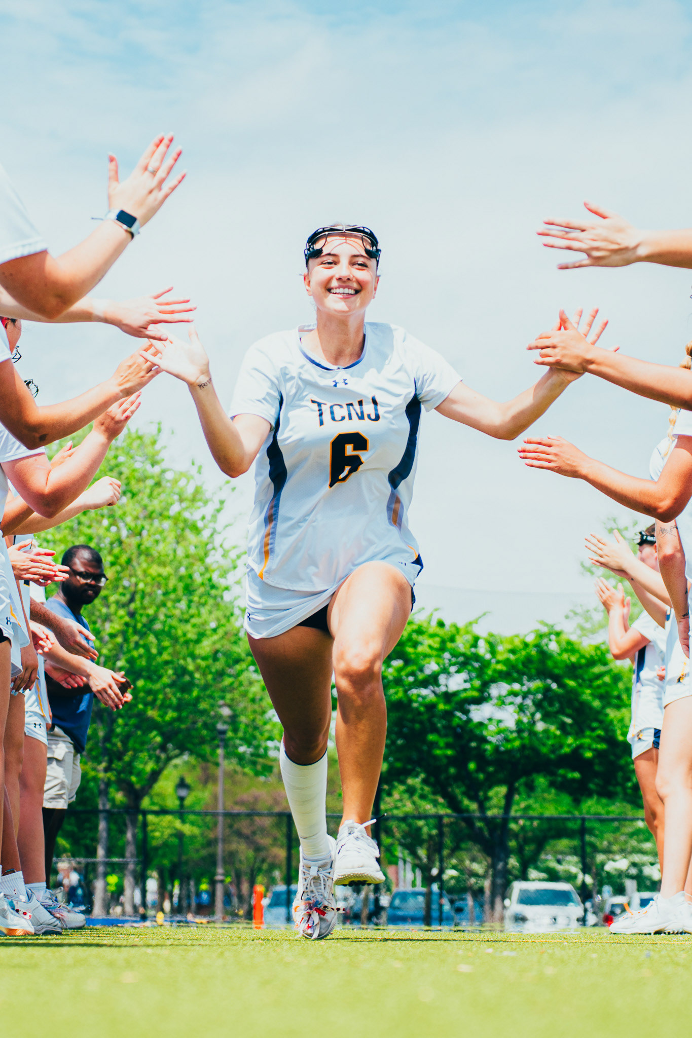The College of New Jersey lacrosse defender Ashly Herlihy (6) smiles pregame before the game against Rowan University at TCNJ Field Hockey and Lacrosse Complex in Ewing, N.J., on May 3, 2025.