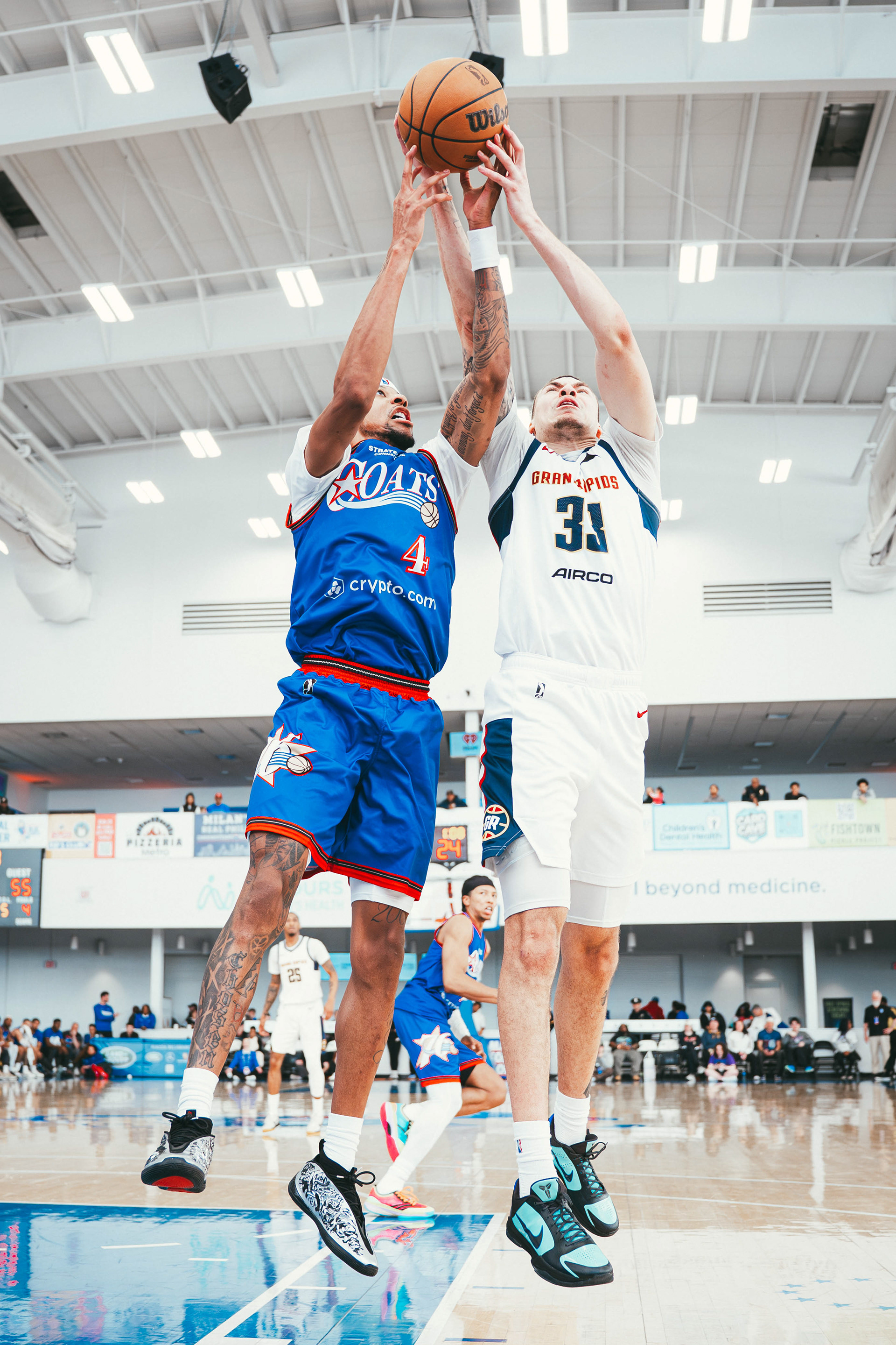 Delaware Blue Coats forward Dalen Terry (4) and Grand Rapids Gold forward Coleman Hawkins (33) battle for a rebound during a game at Chase Fieldhouse on March 1, 2026.