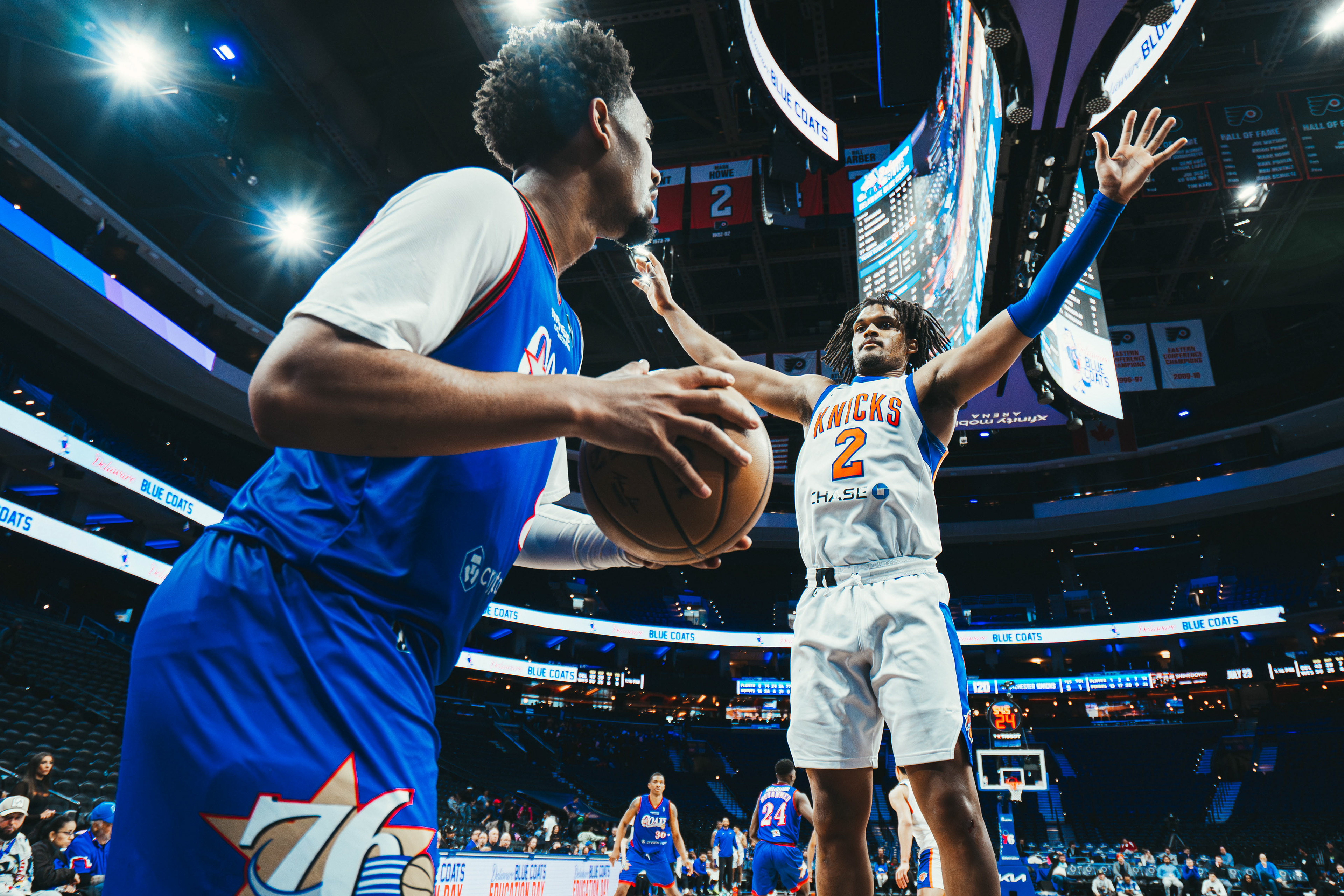 Westchester Knicks forward Dillon Jones (2) attempts to block an inbound pass from Delaware Blue Coats forward Saint Thomas (8) at Xfinity Mobile Arena on March 4, 2026.