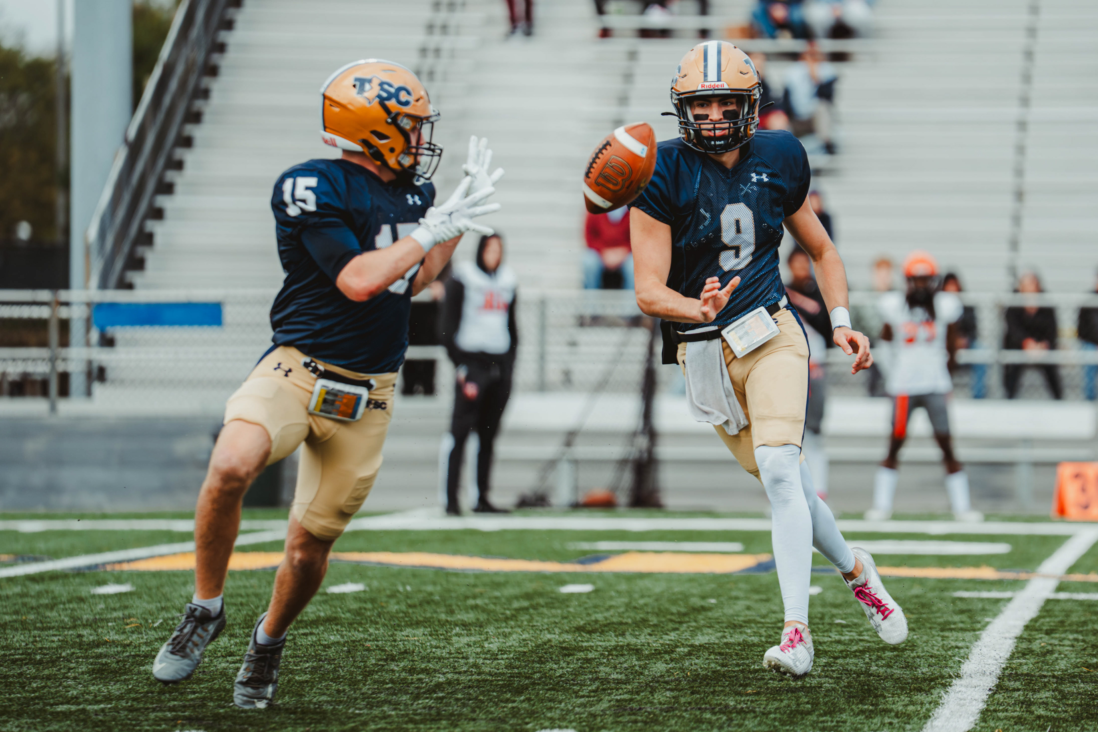 The College of New Jersey quarterback Dean Licari (9) passes the football to wide receiver Alex Dille (15) during a game against William Paterson University at Lions Stadium in Ewing, N.J., on Oct. 11, 2025. 