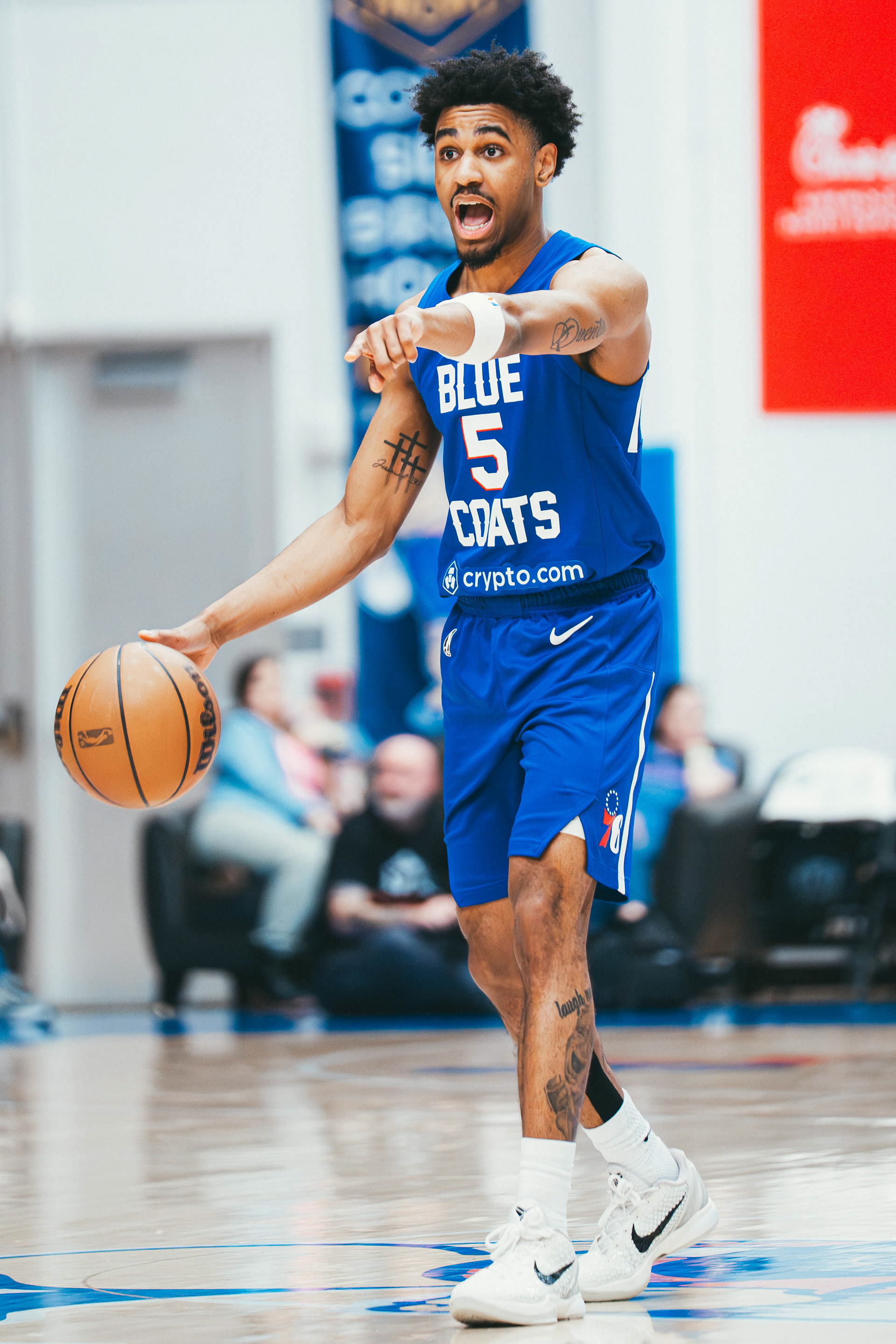 Delaware Blue Coats guard Kellen Tynes dribbles the ball up the court during a game against the Oklahoma City Blue at Chase Fieldhouse on March 14, 2026.