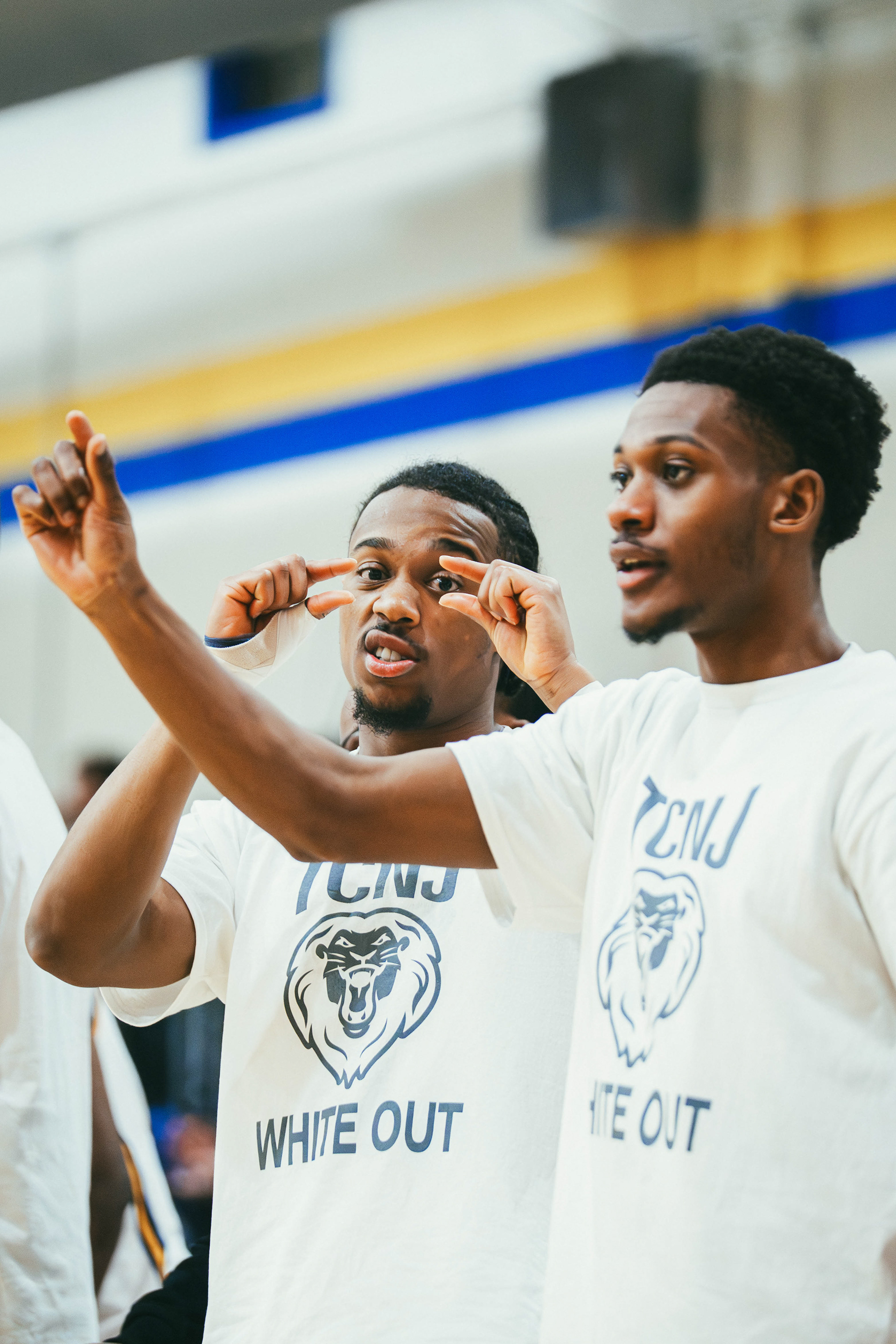 The College of New Jersey guards Connor Howard (4) and Jaydis McFadden (11) celebrate after a dunk during a game against Stockton University at Packer Hall in Ewing, N.J., on Jan. 29, 2026.