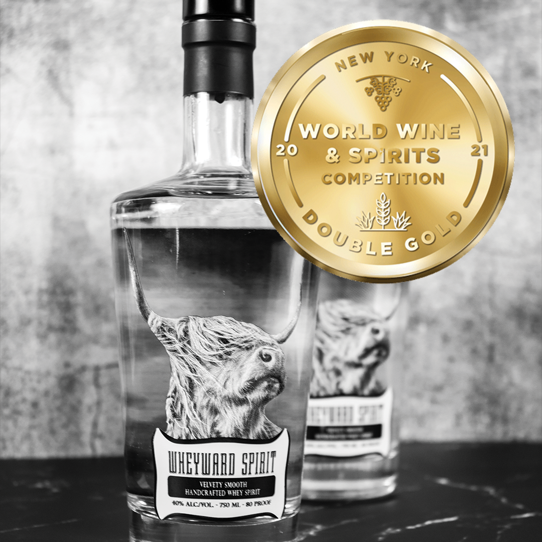 Two bottles of Wheyward Spirit with a gold medal titled New York World Wine and Spirits Competition Double Gold 2021