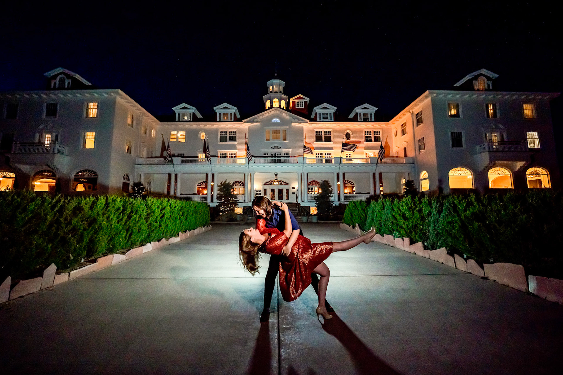 Engagement session in Estes Park Colorado with two beautiful ladies and their dog. Portraits at the Stanley Hotel