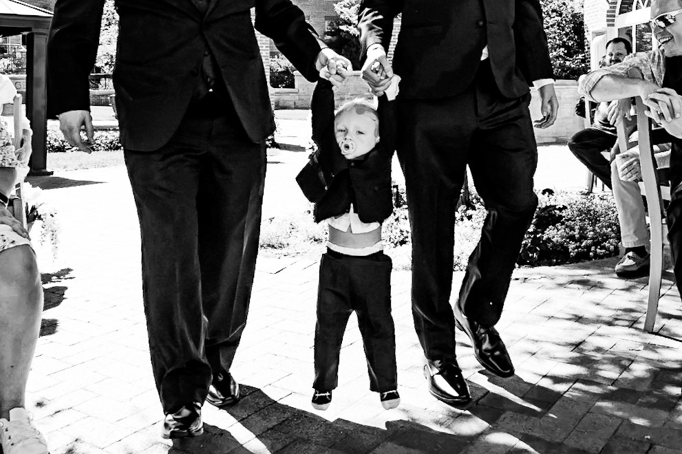 Fun and chill wedding at the Knoebel Events Center in Denver, Colorado featuring an adorable toddler ringbearer