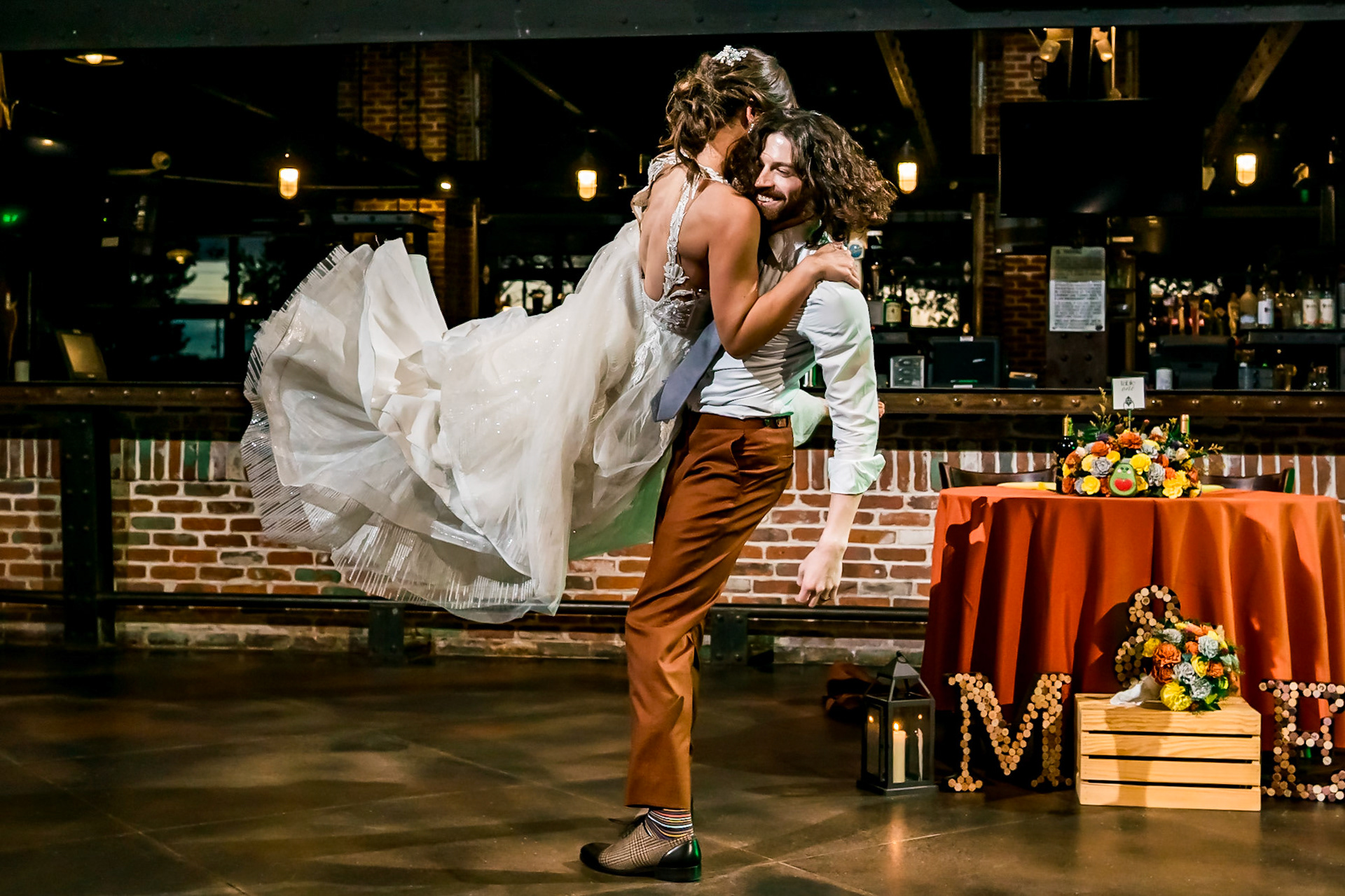Fun, colorful, nerdy wedding with a dog ringbearer and bubble guns at Mile High Station in Denver, CO