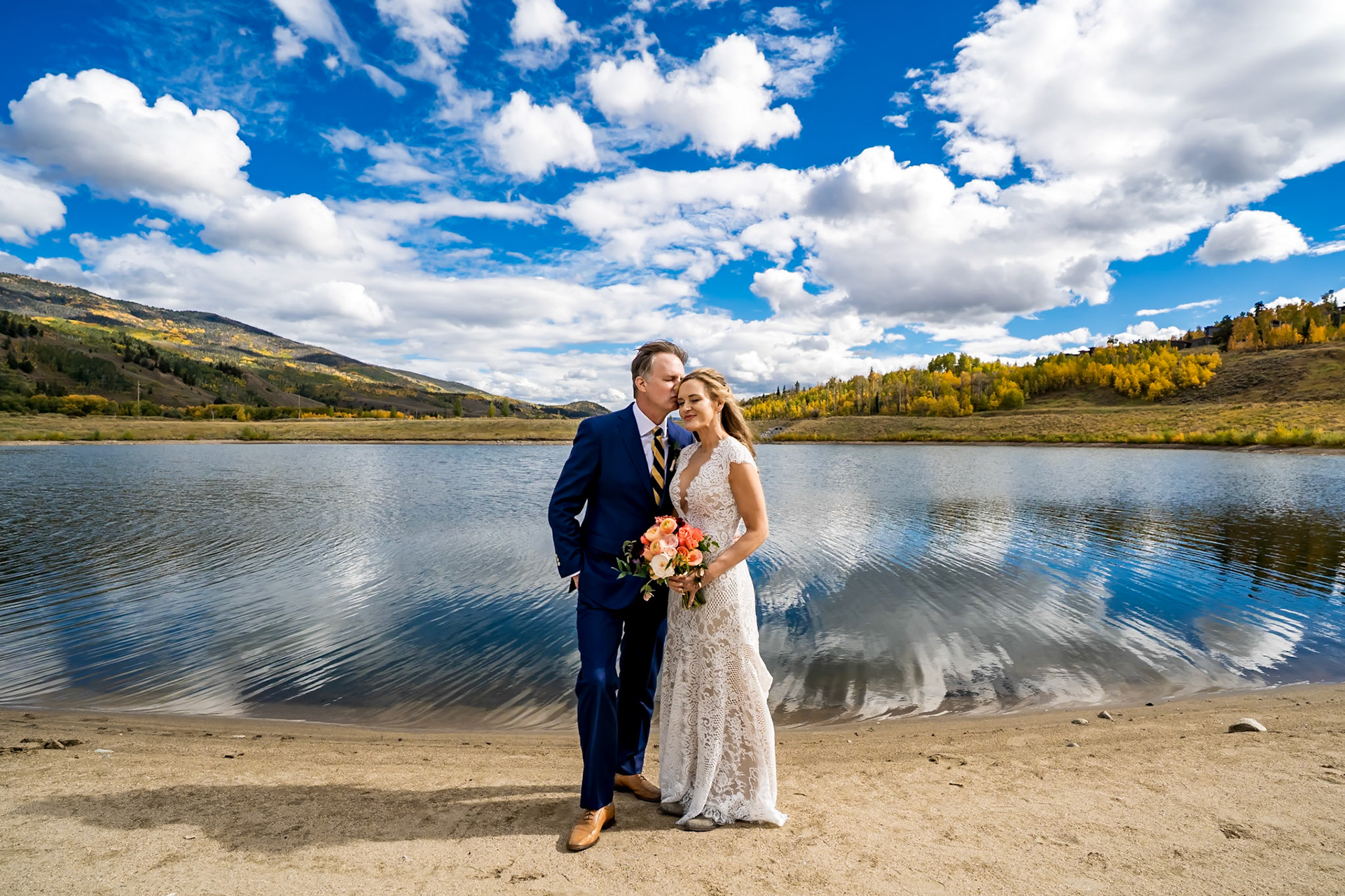 Fall wedding in Silverthorne, Colorado with a couple and their twin 4-year-old boys, surrounded by colorful mountain foliage
