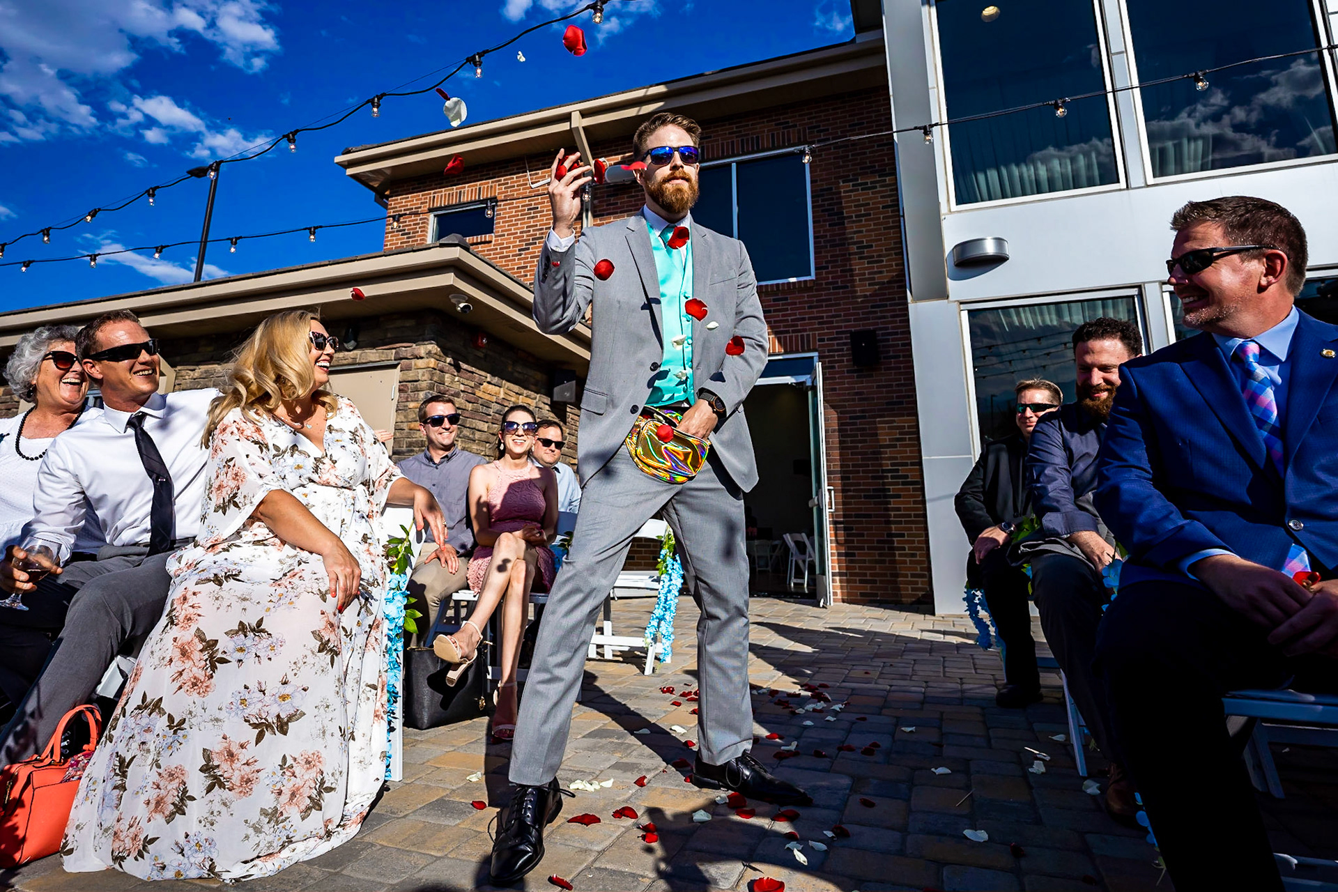 Colorful wedding at Wedgewood Ashely Ridge in Colorado. Getting ready at home. First look and portraits in the park. Flower man, couples portraits with bubbles.