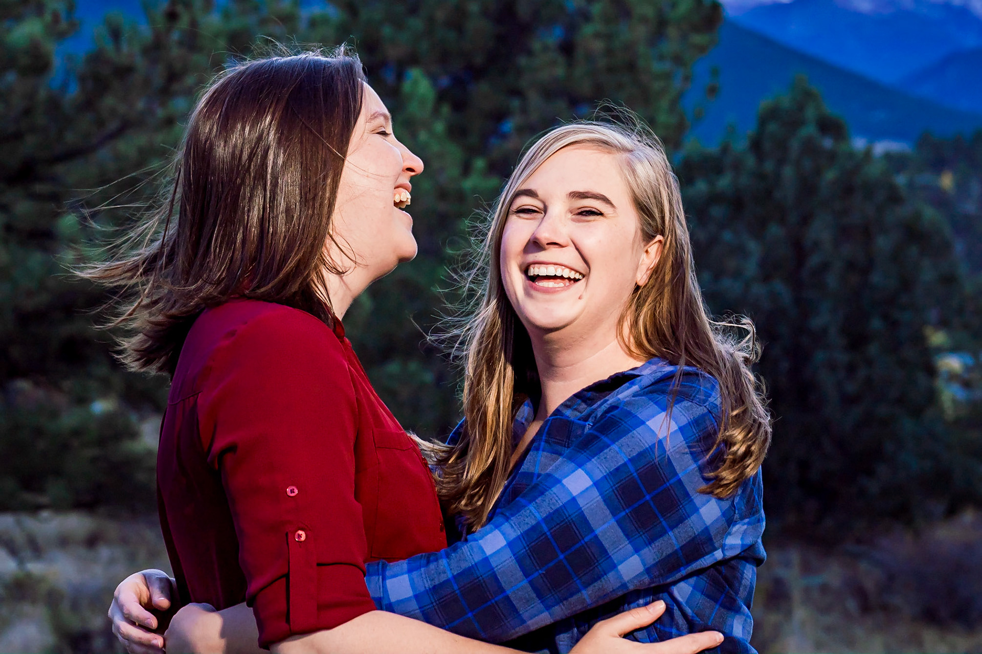 Engagement session in Estes Park Colorado with two beautiful ladies and their dog. Portraits at the Stanley Hotel