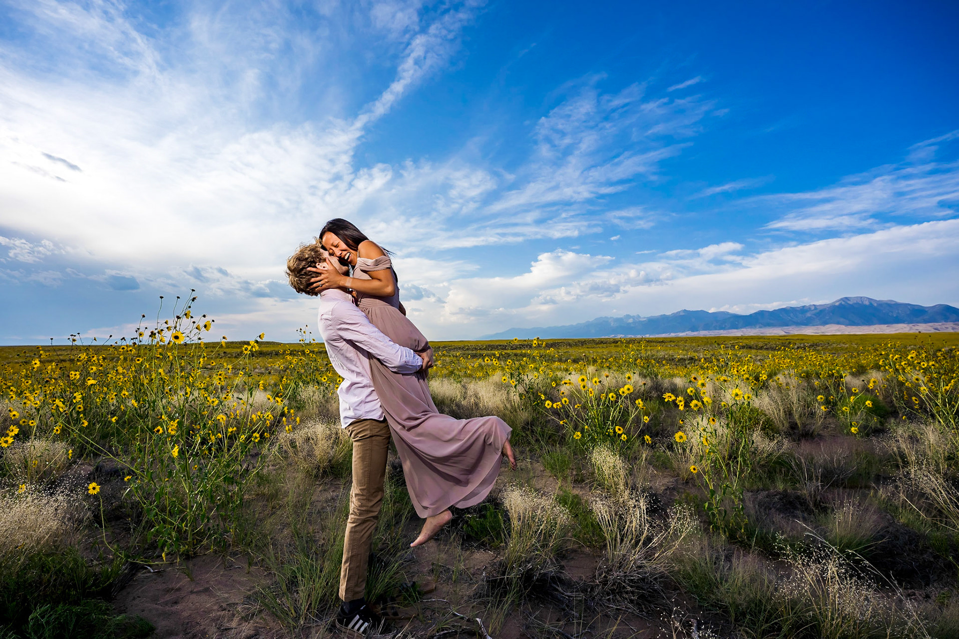 Adventure engagement session at the Great Sand Dunes in Colorado. Camping trip with husky dog. Sunrise and Sunset photos on the Dunes.