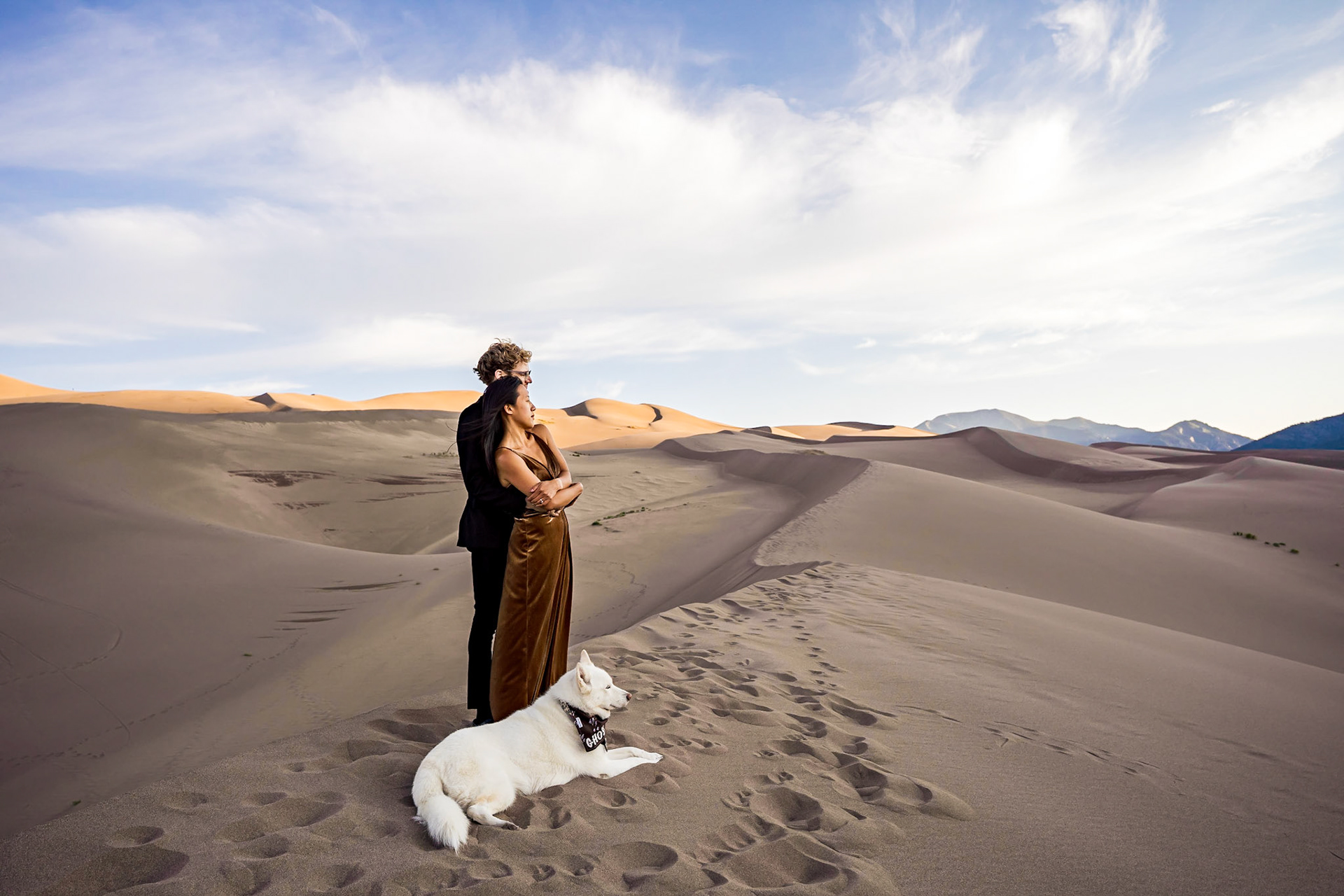 Adventure engagement session at the Great Sand Dunes in Colorado. Camping trip with husky dog. Sunrise and Sunset photos on the Dunes.