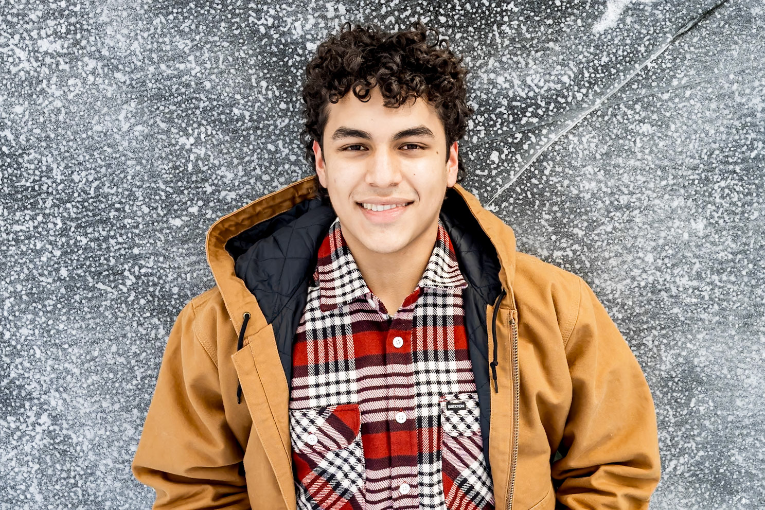Snowy winter high school senior portraits for a young man in Rocky Mountain National Park, CO