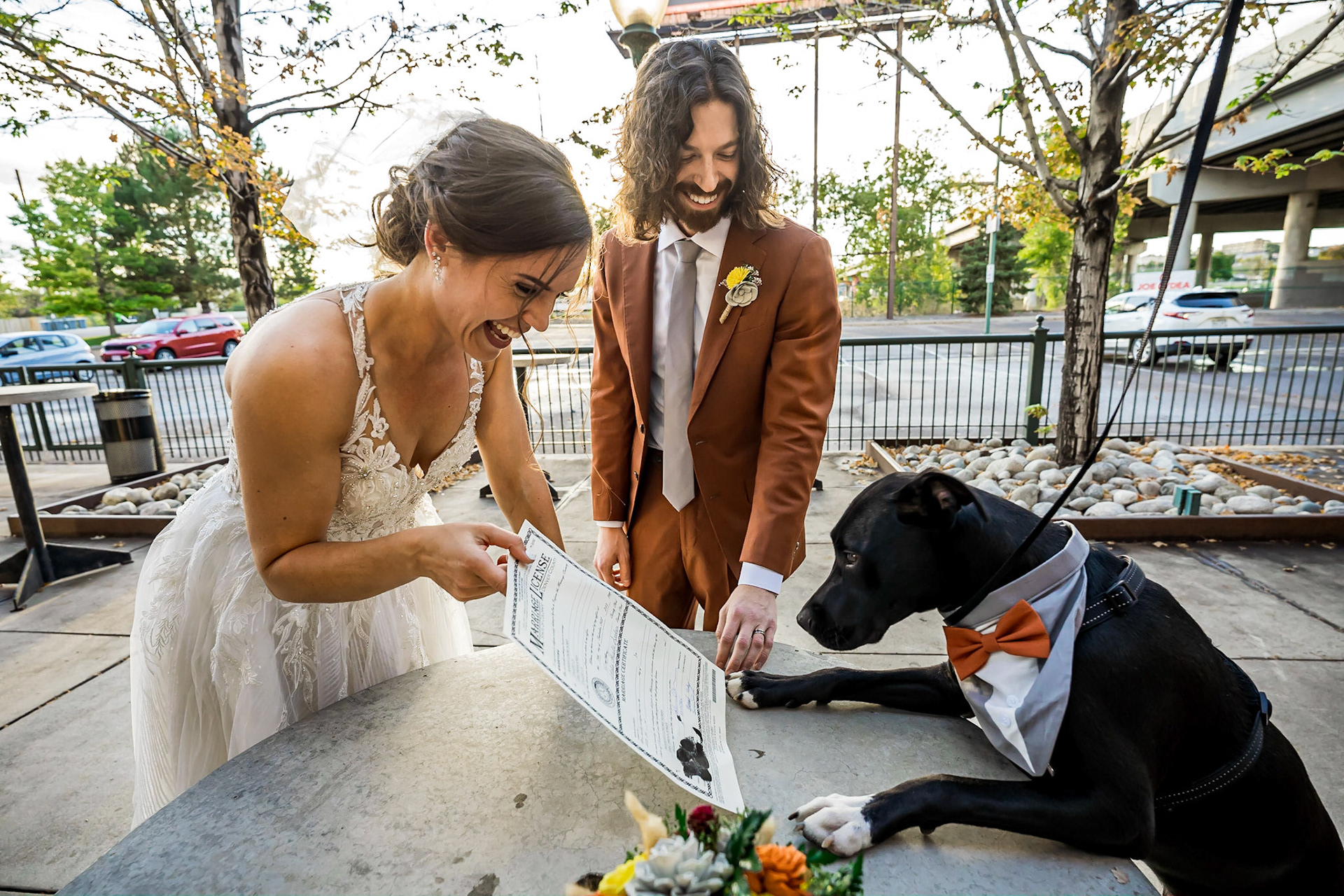 Fun, colorful, nerdy wedding with a dog ringbearer and bubble guns at Mile High Station in Denver, CO