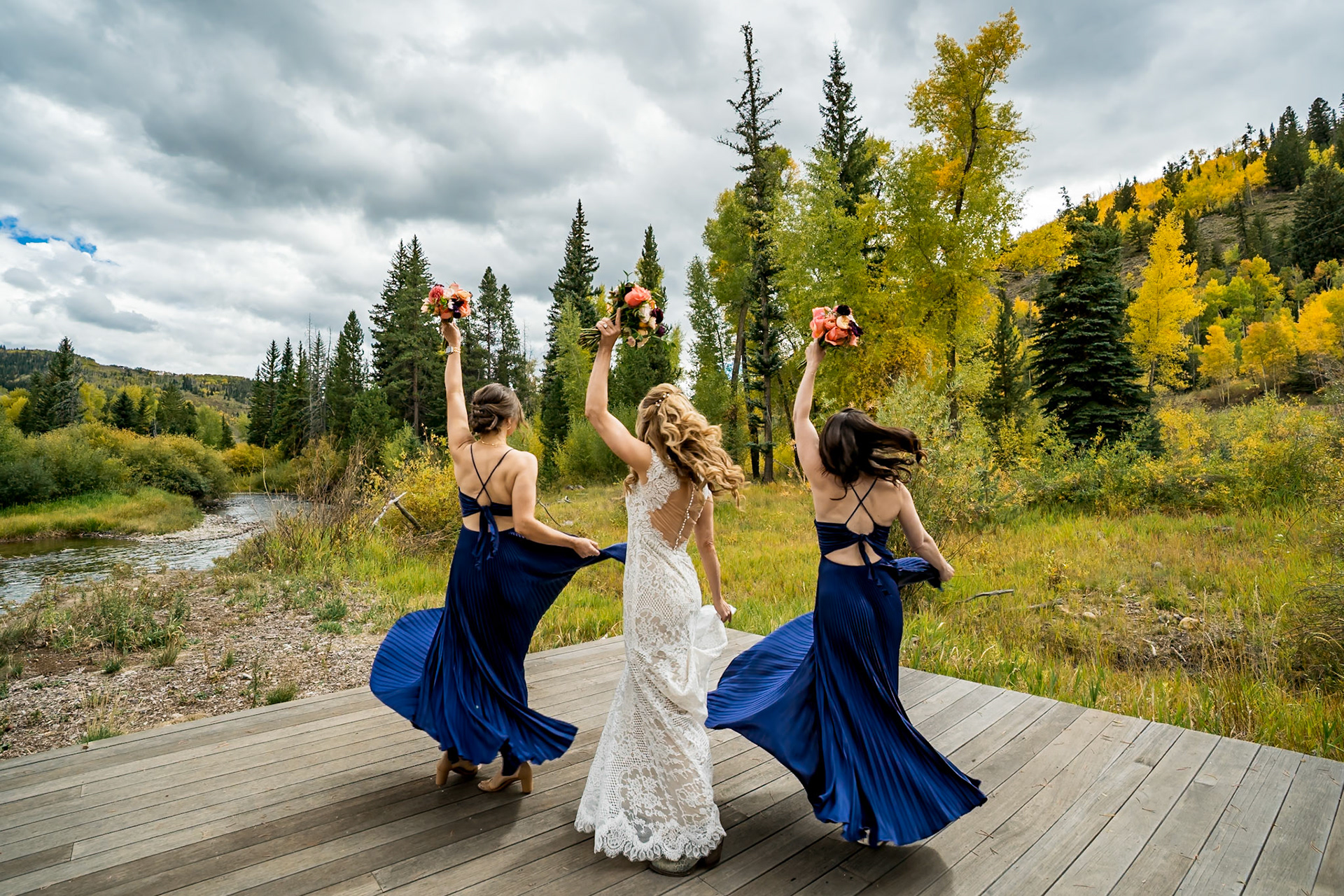 Fall wedding in Silverthorne, Colorado with a couple and their twin 4-year-old boys, surrounded by colorful mountain foliage